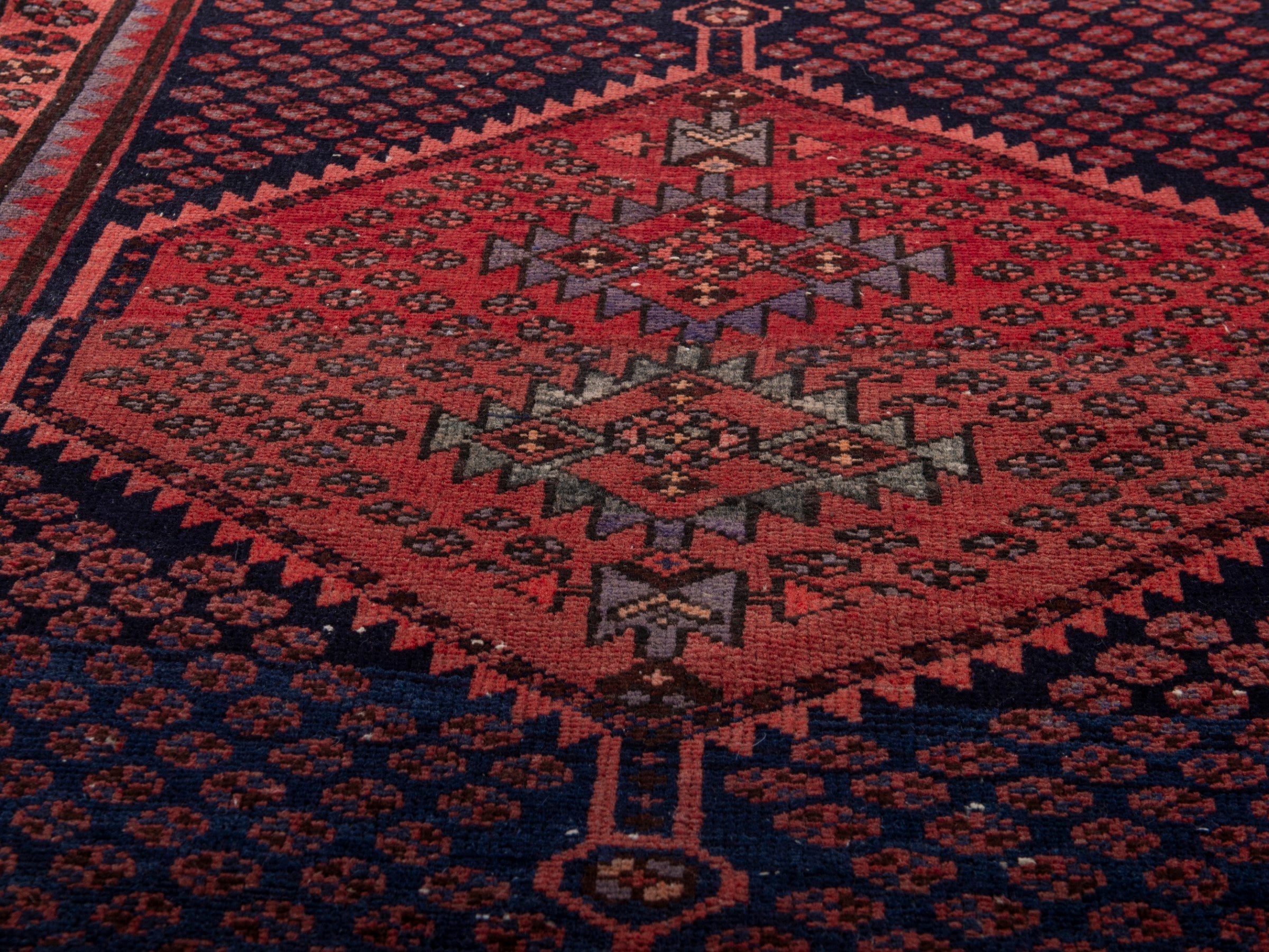 Persian Zanjan accent rug in navy and rust, view 9 of 17