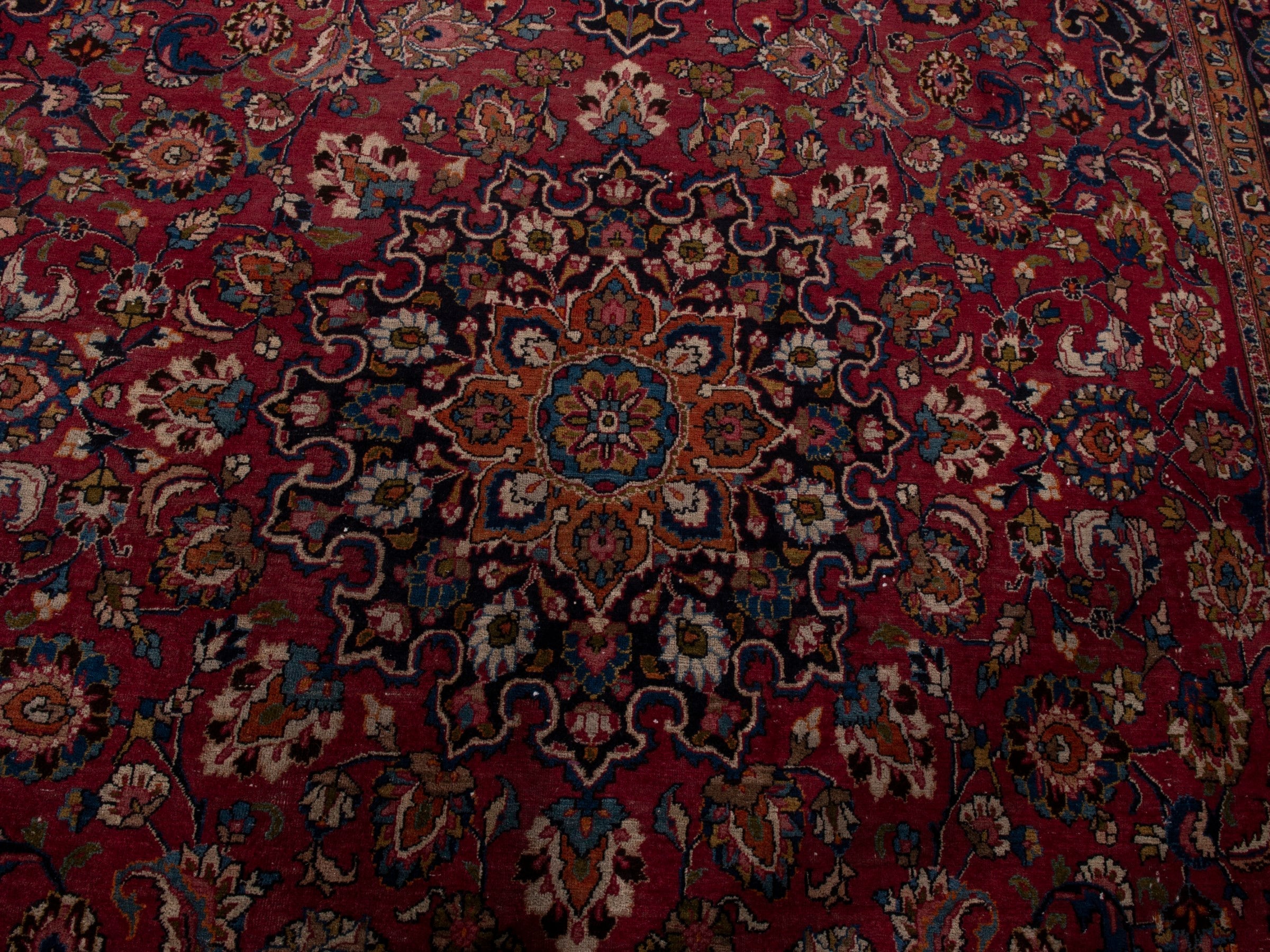 Persian Mashhad oversized rug in burgundy and navy, view 5 of 10