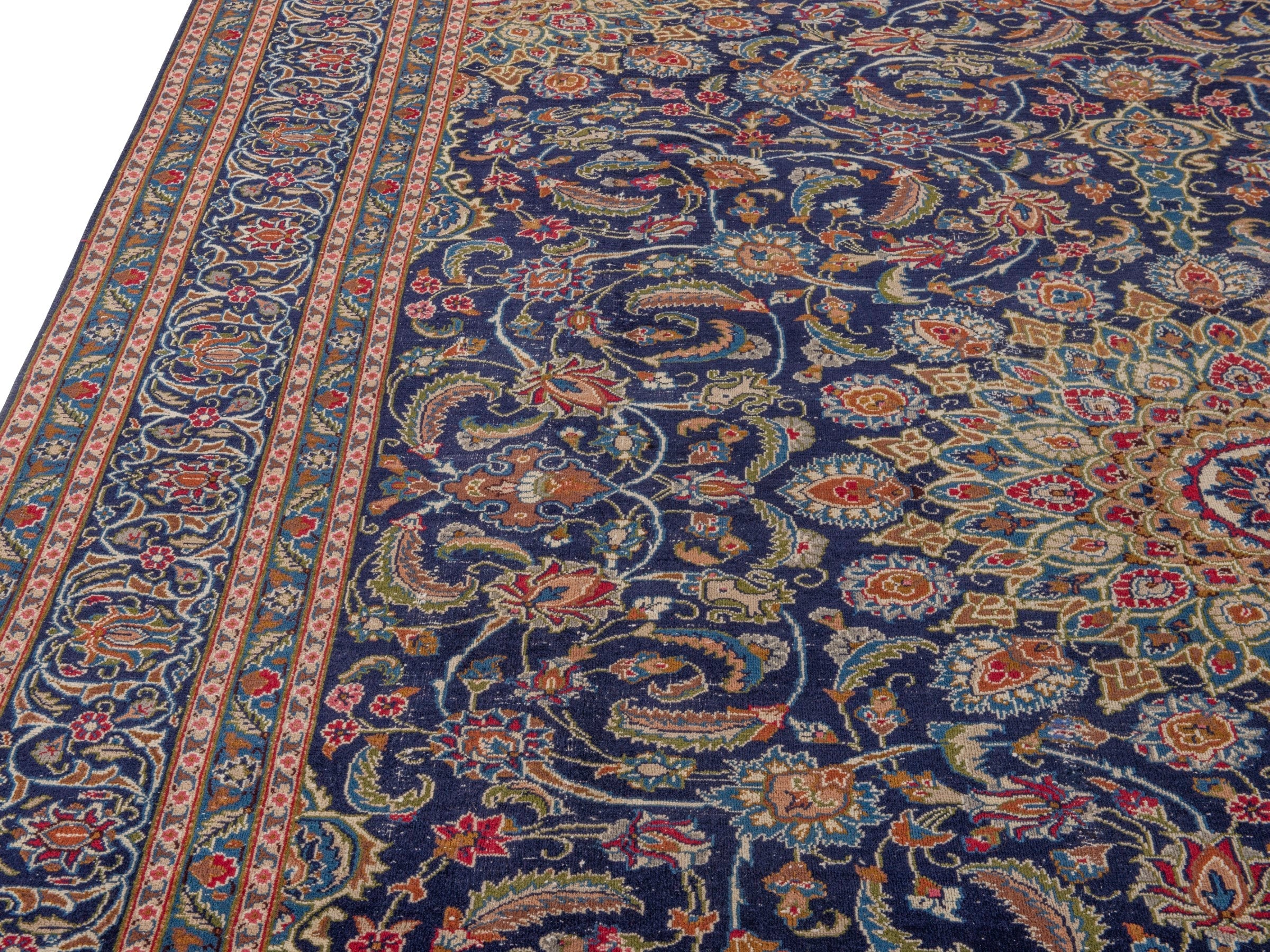 Persian Kashmar oversized rug in navy and rust, view 6 of 17