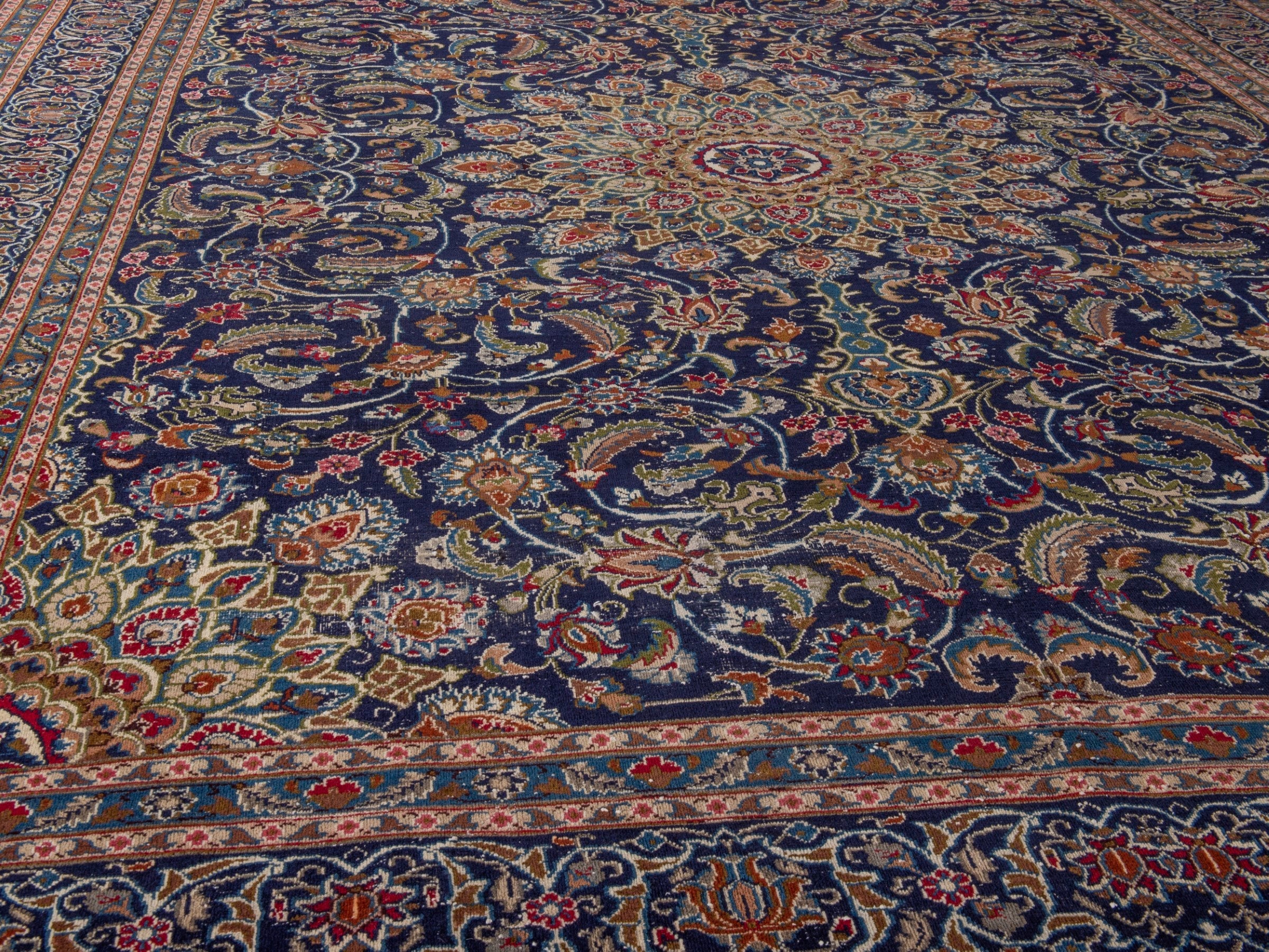 Persian Kashmar oversized rug in navy and rust, view 8 of 17