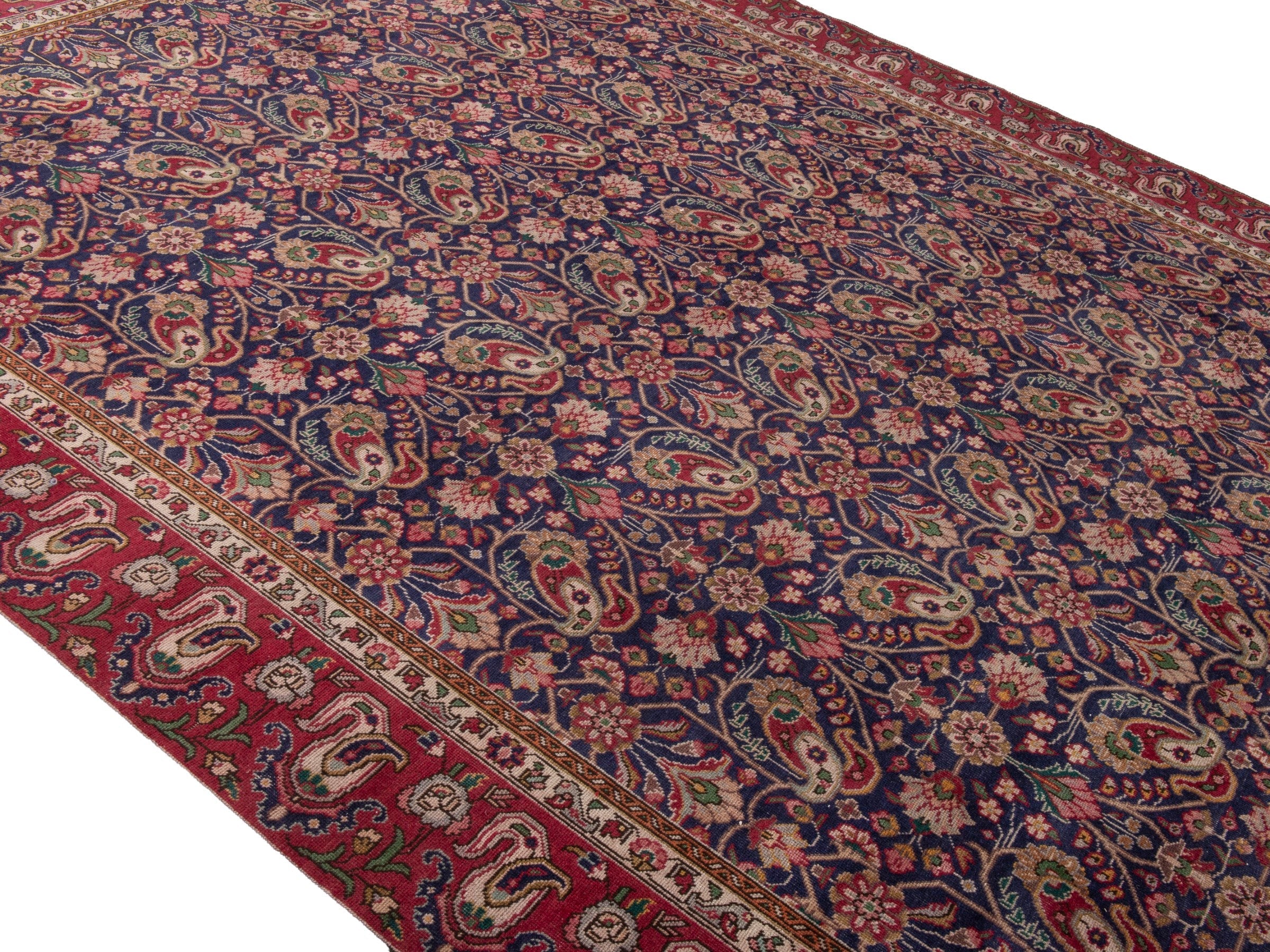 Persian Tabriz oversized rug in navy and burgundy, view 3 of 17
