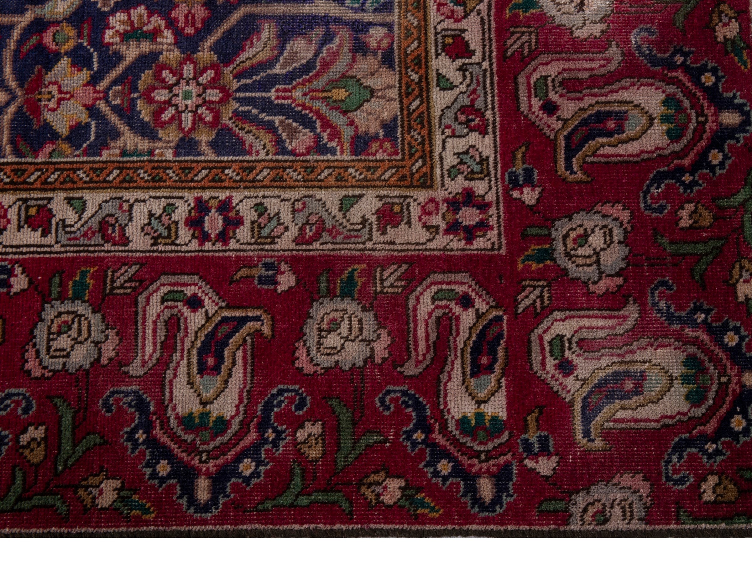 Persian Tabriz oversized rug in navy and burgundy, view 4 of 17