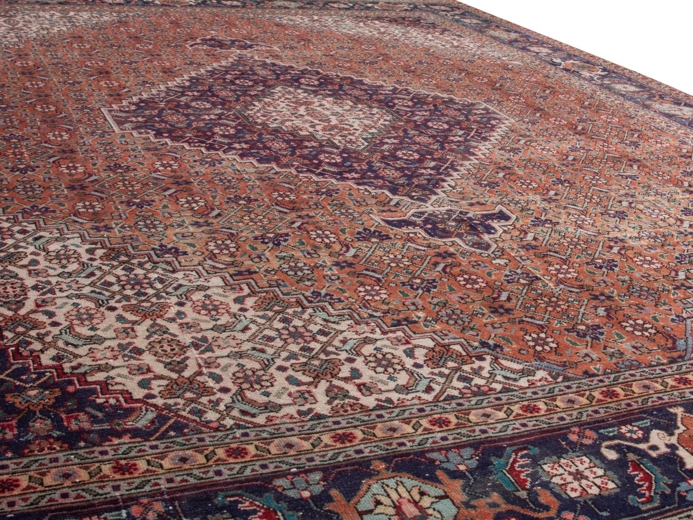 Persian Tabriz oversized rug in rust and navy, view 10 of 21