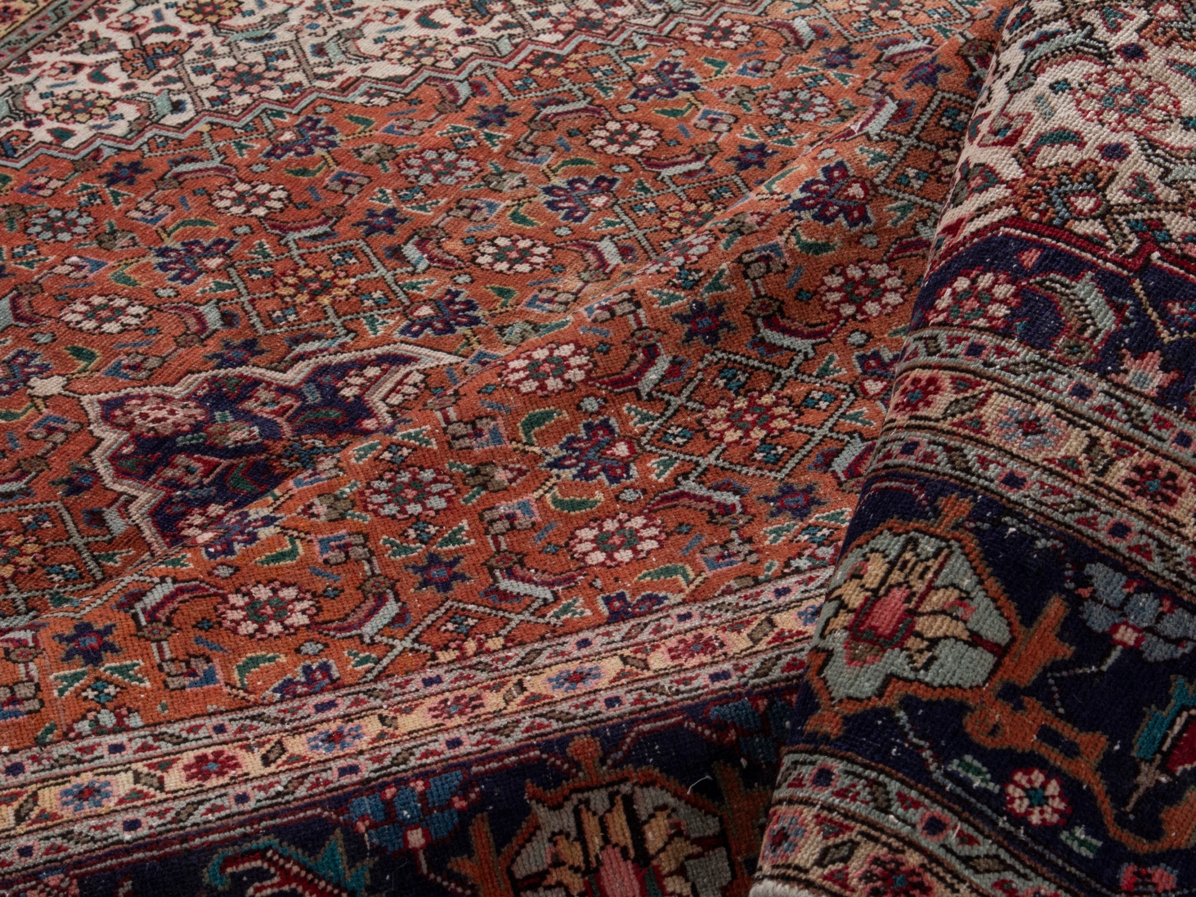 Persian Tabriz oversized rug in rust and navy, view 17 of 21