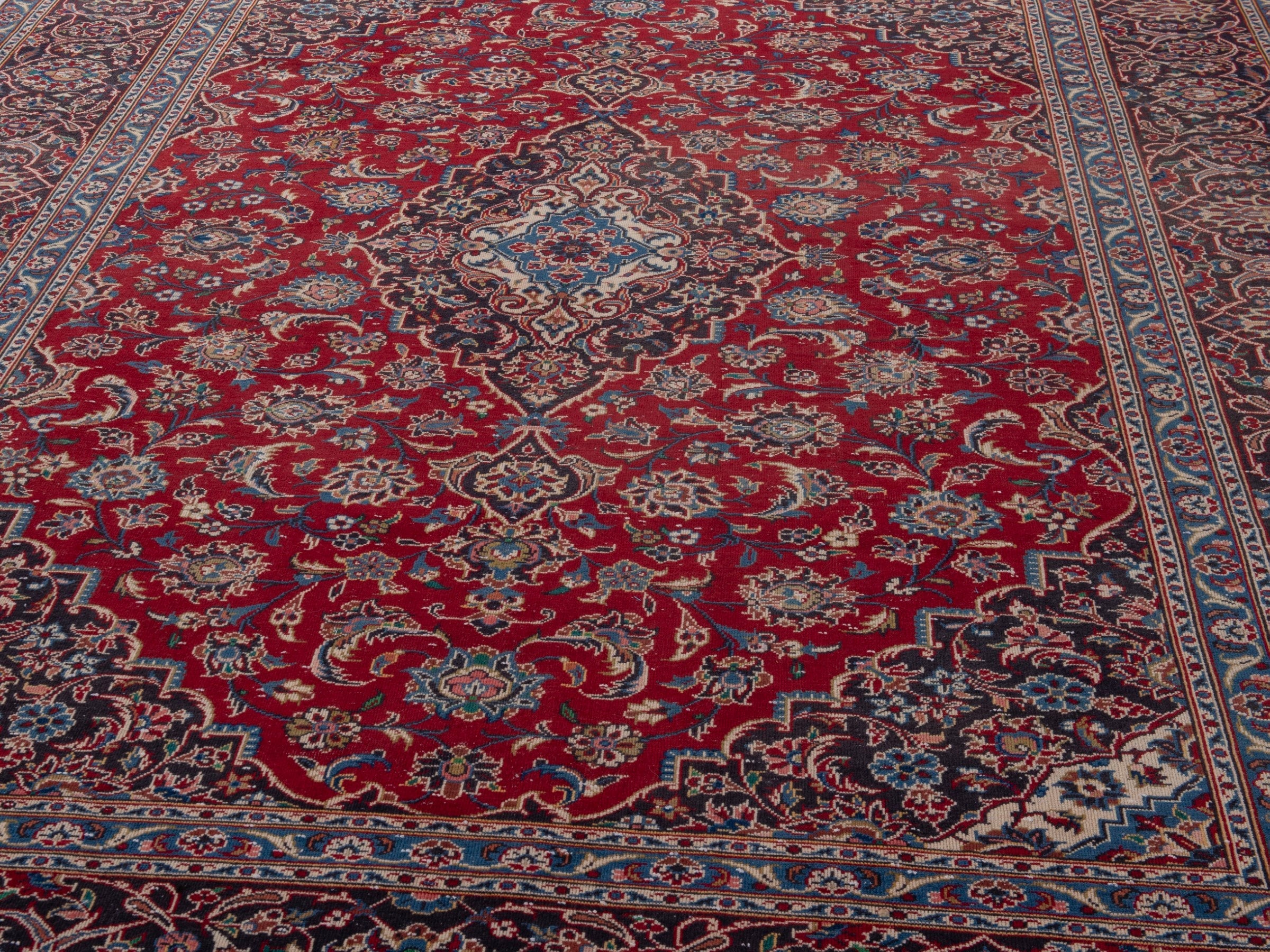 Persian Kashan oversized rug in deep red and brown, view 9 of 21
