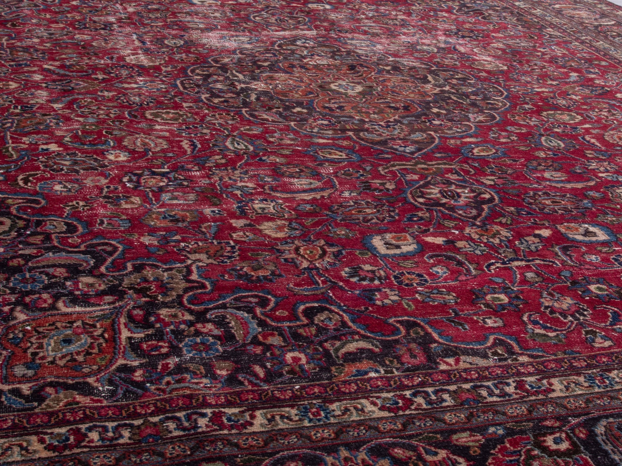 Persian Mashhad oversized rug in deep red and faded red, view 9 of 16