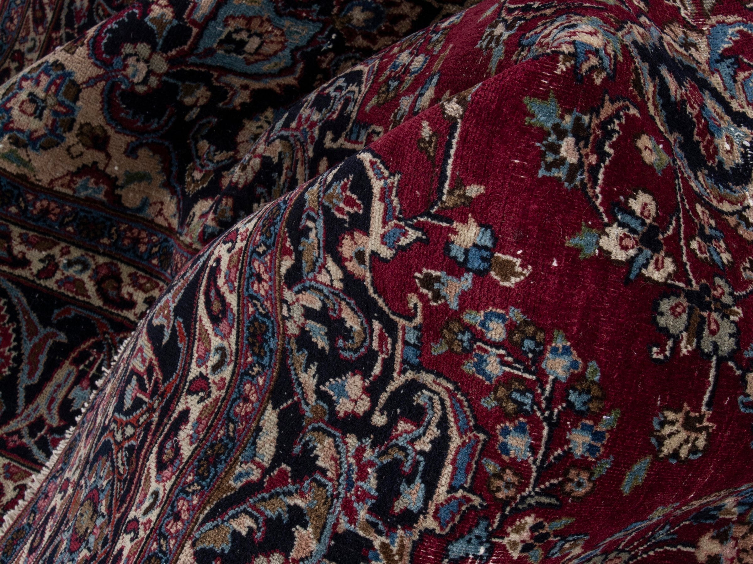 Persian Mashhad oversized rug in burgundy and navy, view 17 of 21