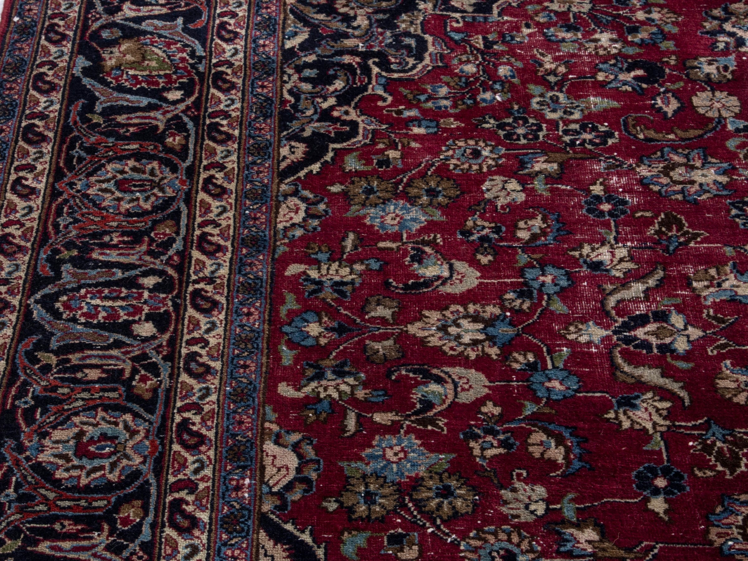 Persian Mashhad oversized rug in burgundy and navy, view 8 of 21