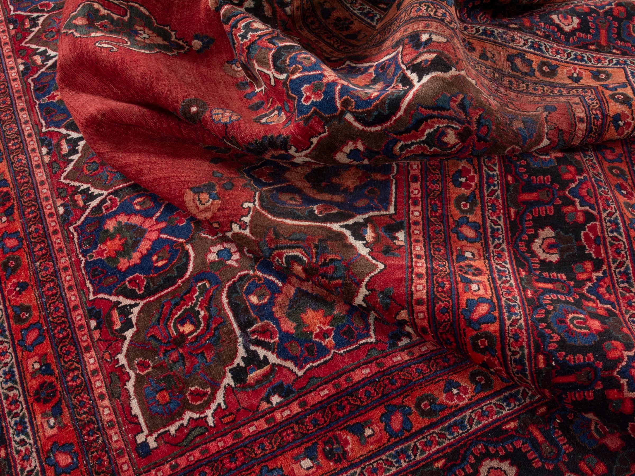 Persian Mashhad oversized rug in deep red and navy, view 16 of 20
