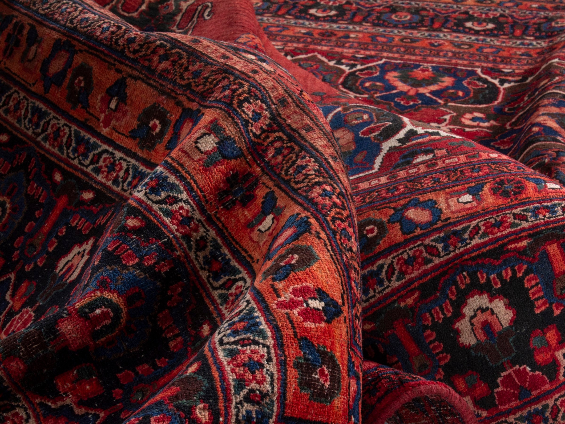 Persian Mashhad oversized rug in deep red and navy, view 18 of 20