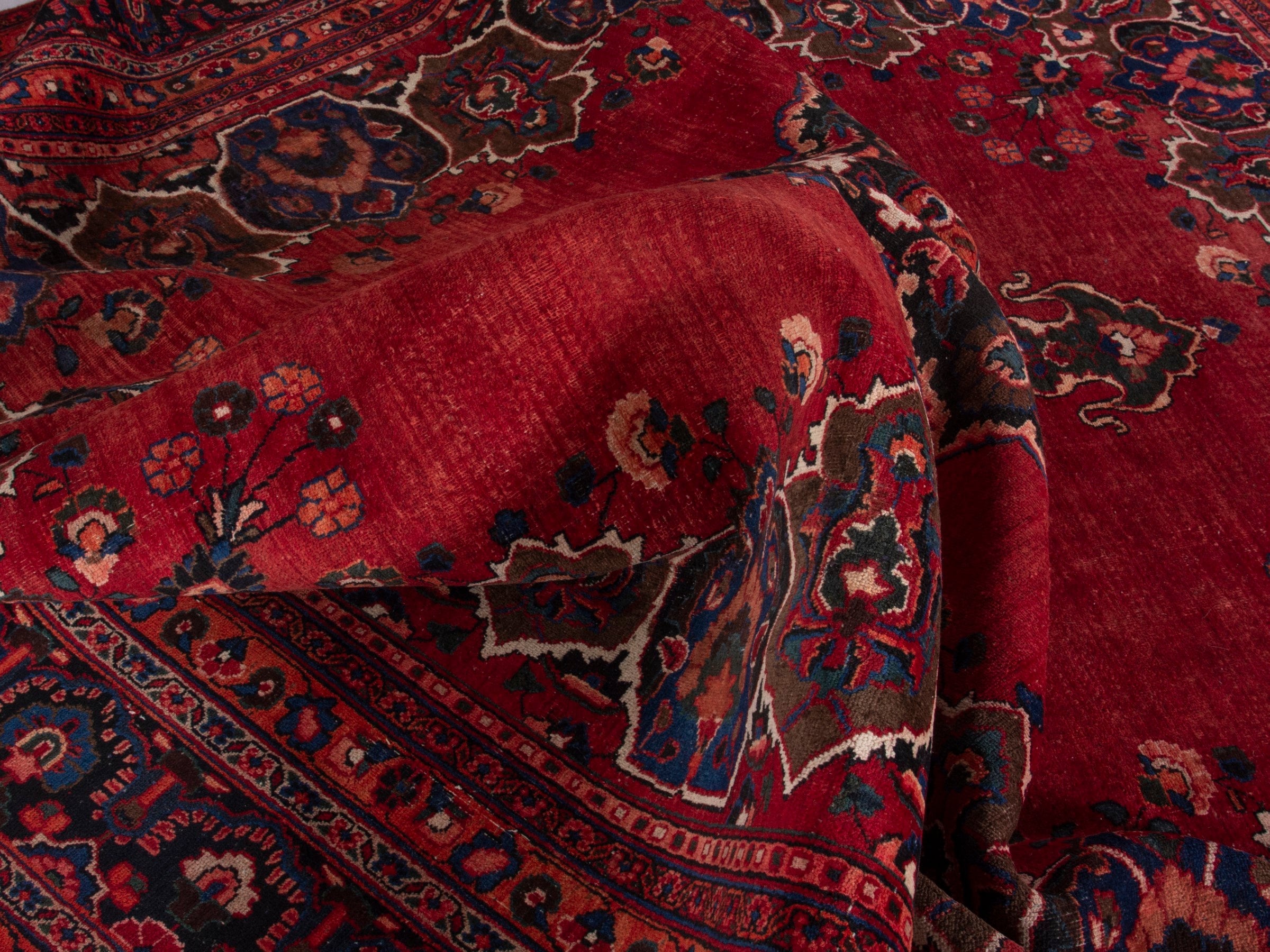 Persian Mashhad oversized rug in deep red and navy, view 19 of 20