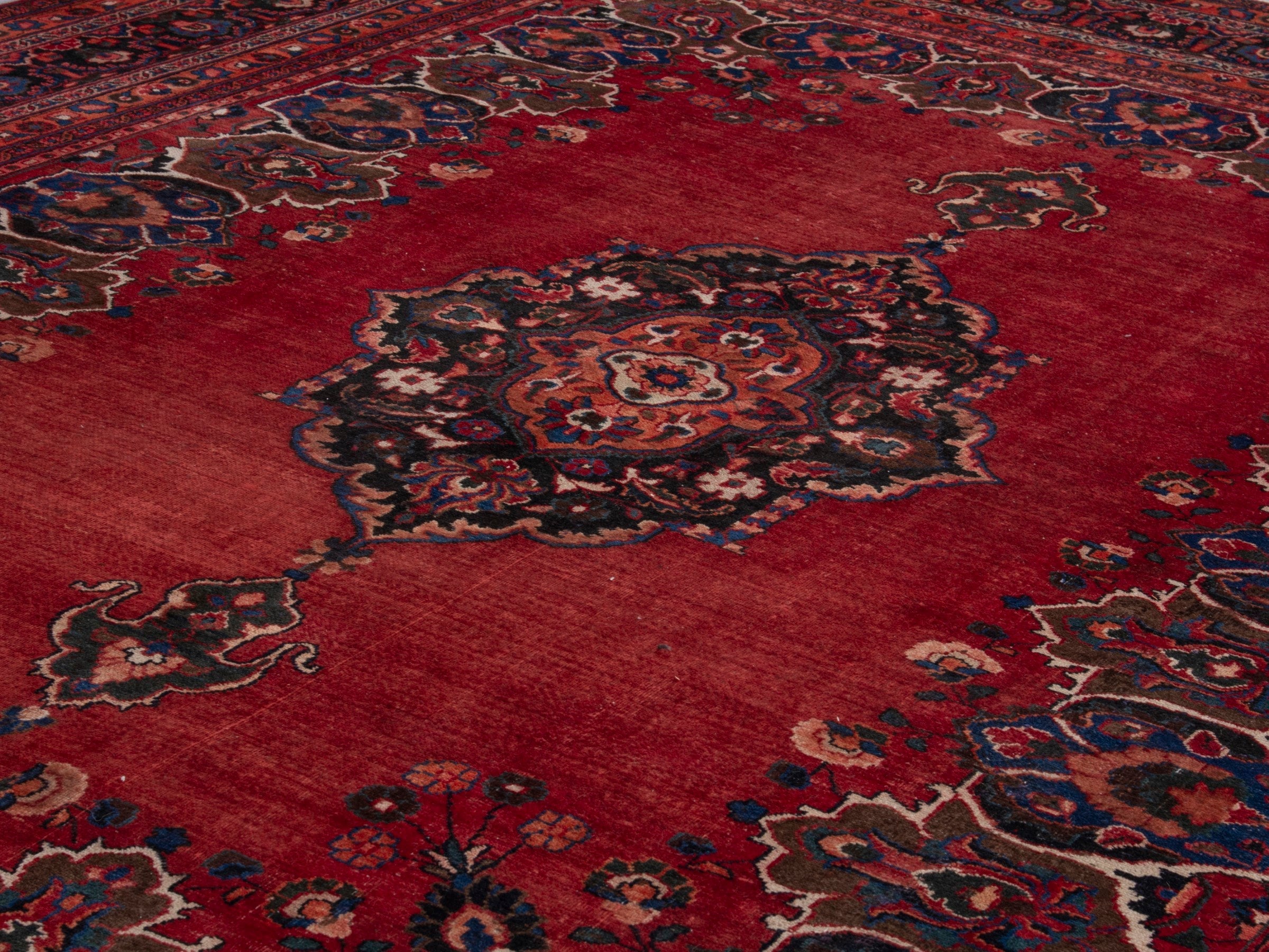 Persian Mashhad oversized rug in deep red and navy, view 9 of 20