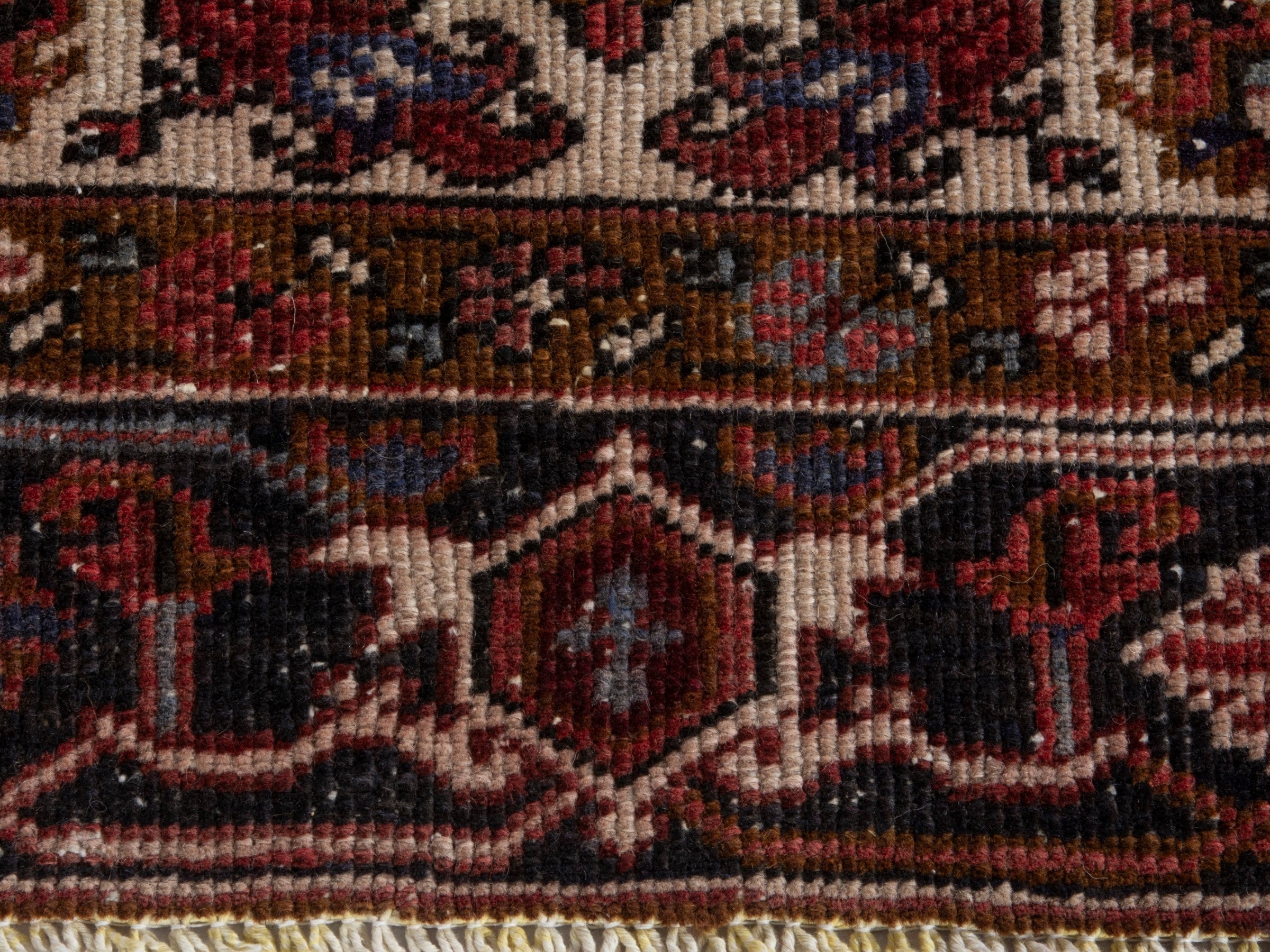 Persian Heriz area rug in deep red and burgundy, view 11 of 19