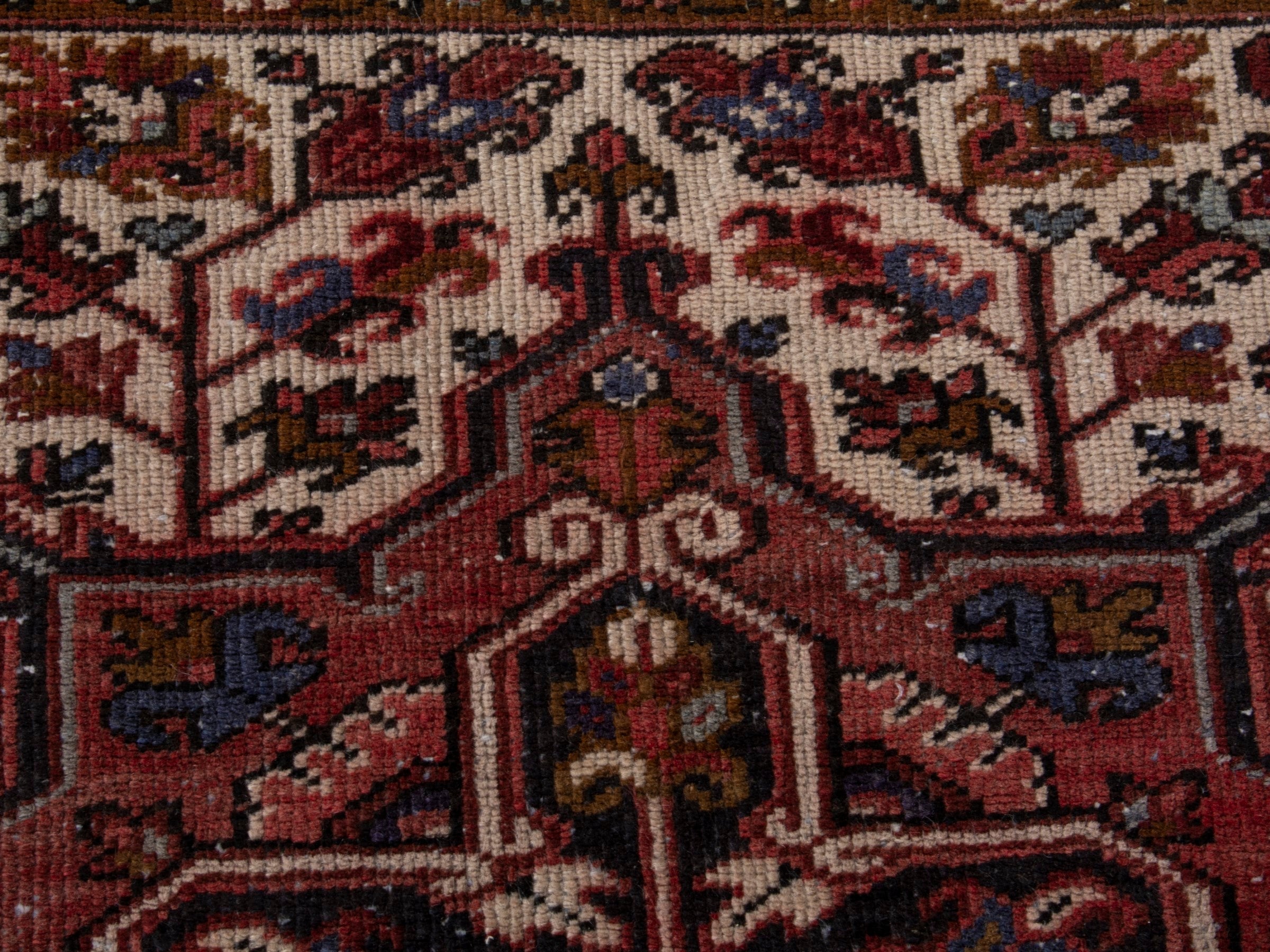 Persian Heriz area rug in deep red and burgundy, view 12 of 19
