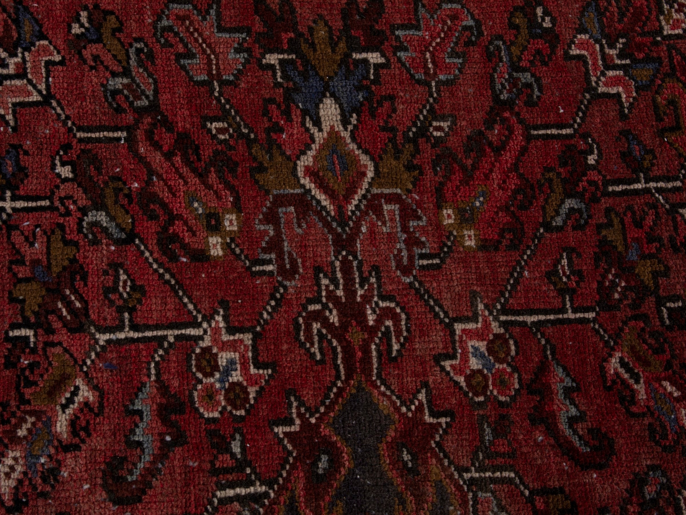 Persian Heriz area rug in deep red and burgundy, view 13 of 19