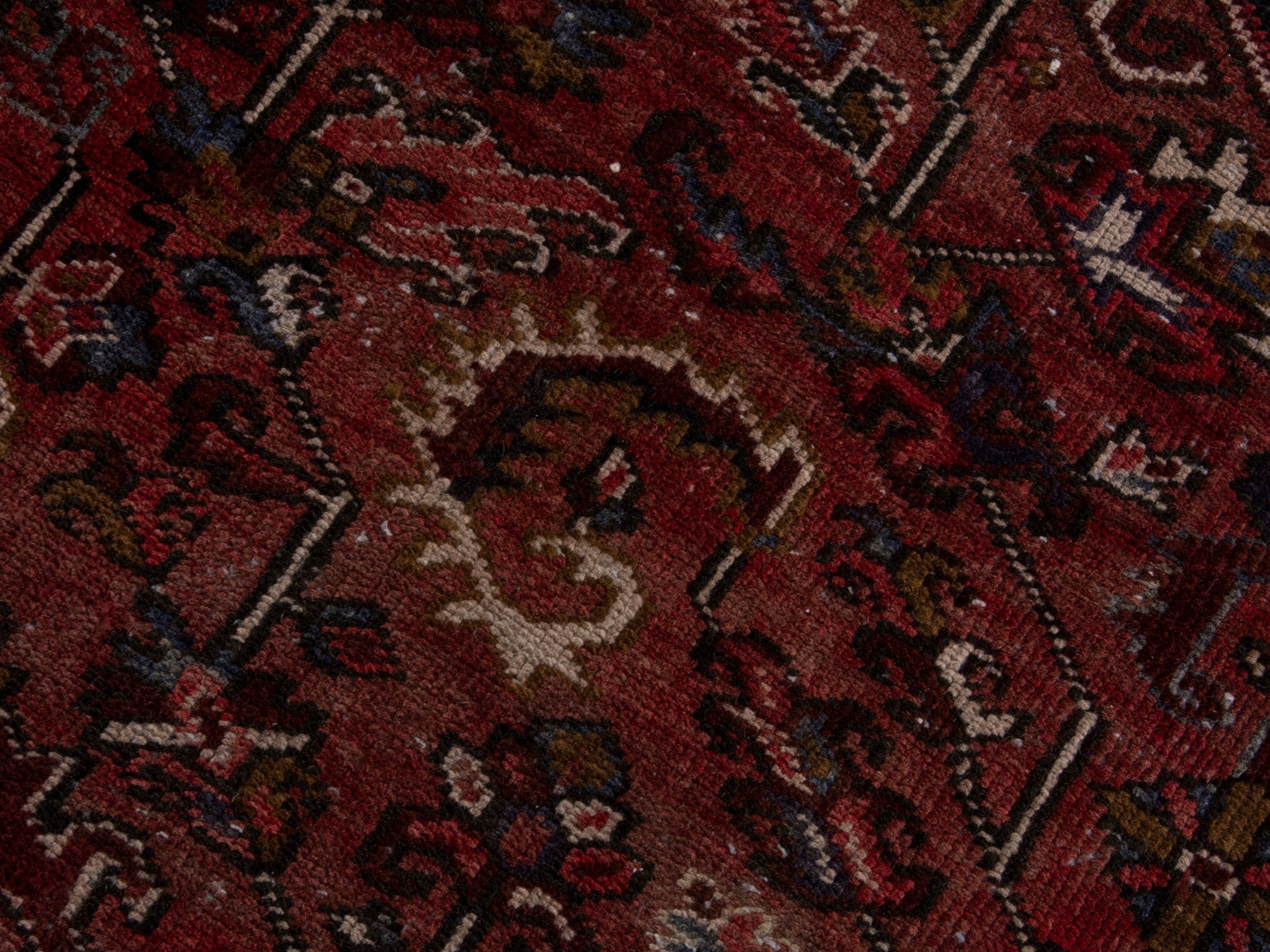 Persian Heriz area rug in deep red and burgundy, view 14 of 19