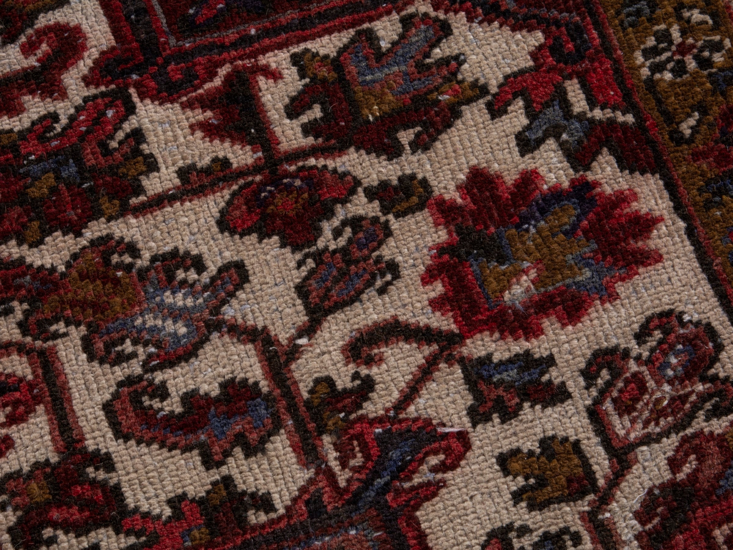 Persian Heriz area rug in deep red and burgundy, view 15 of 19