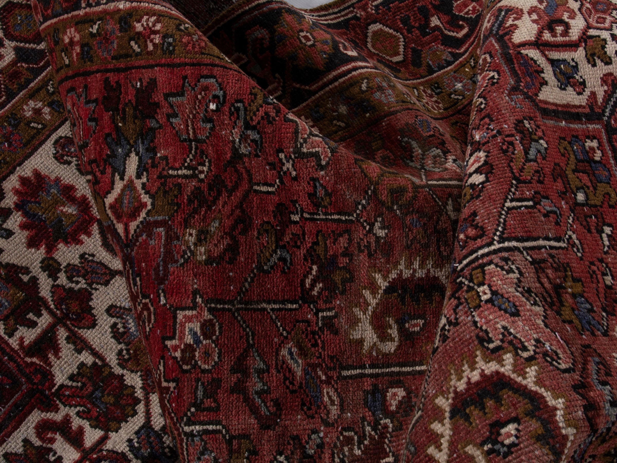 Persian Heriz area rug in deep red and burgundy, view 16 of 19