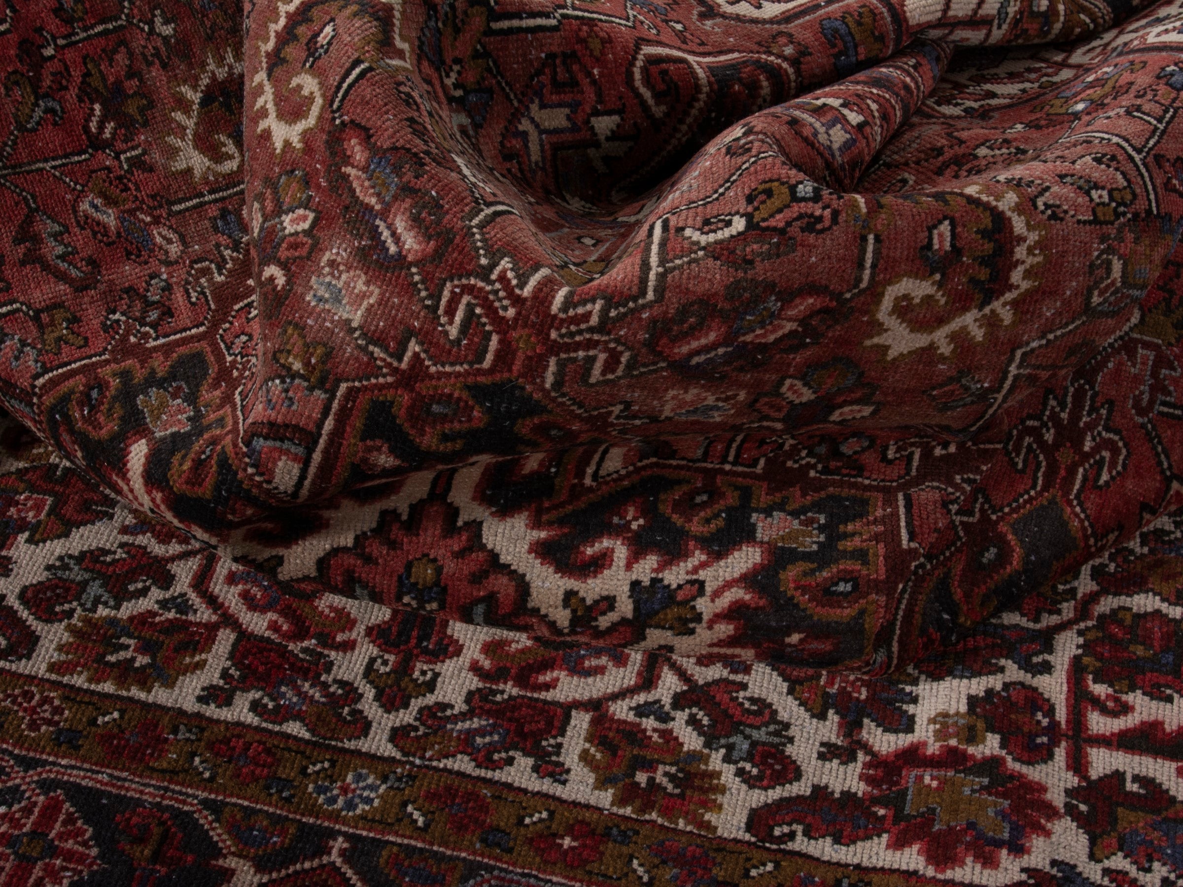 Persian Heriz area rug in deep red and burgundy, view 17 of 19