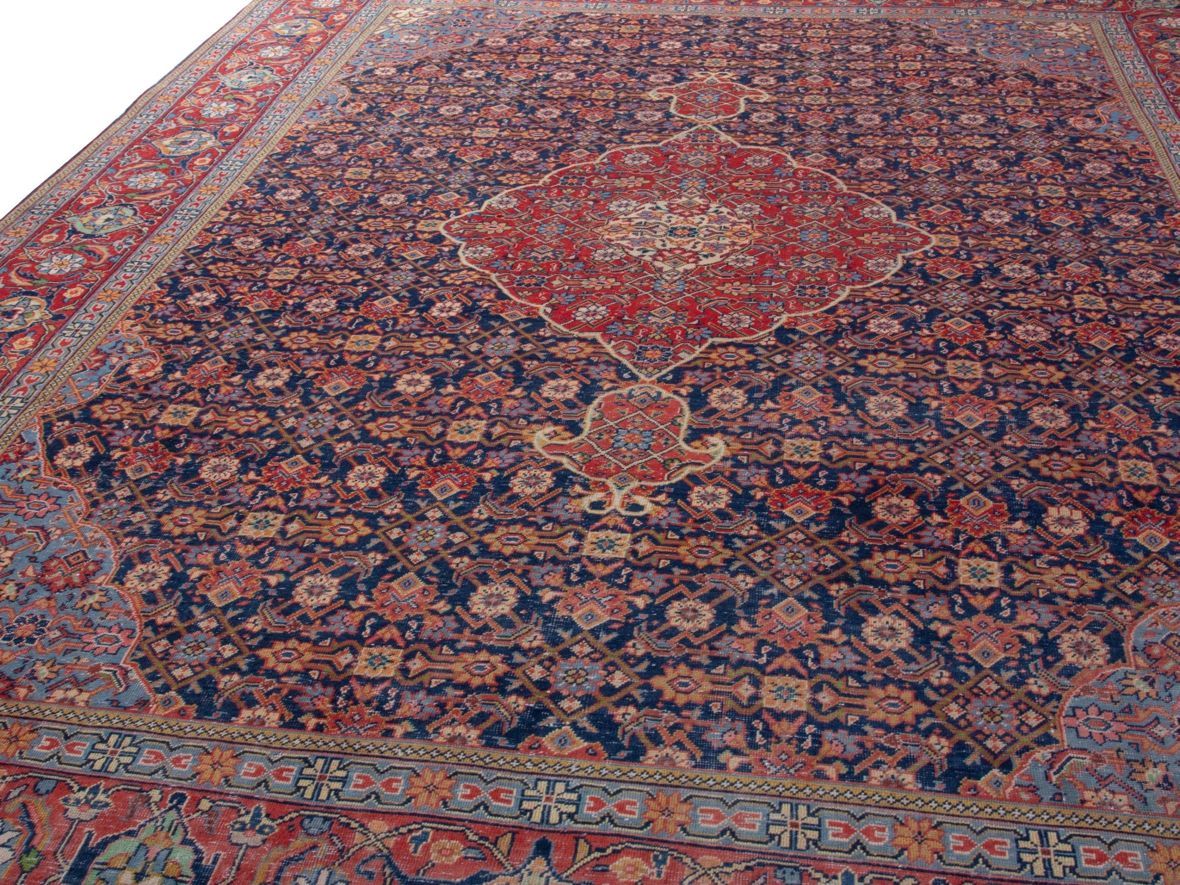 Persian Mahal oversized rug in navy and deep red, view 8 of 21