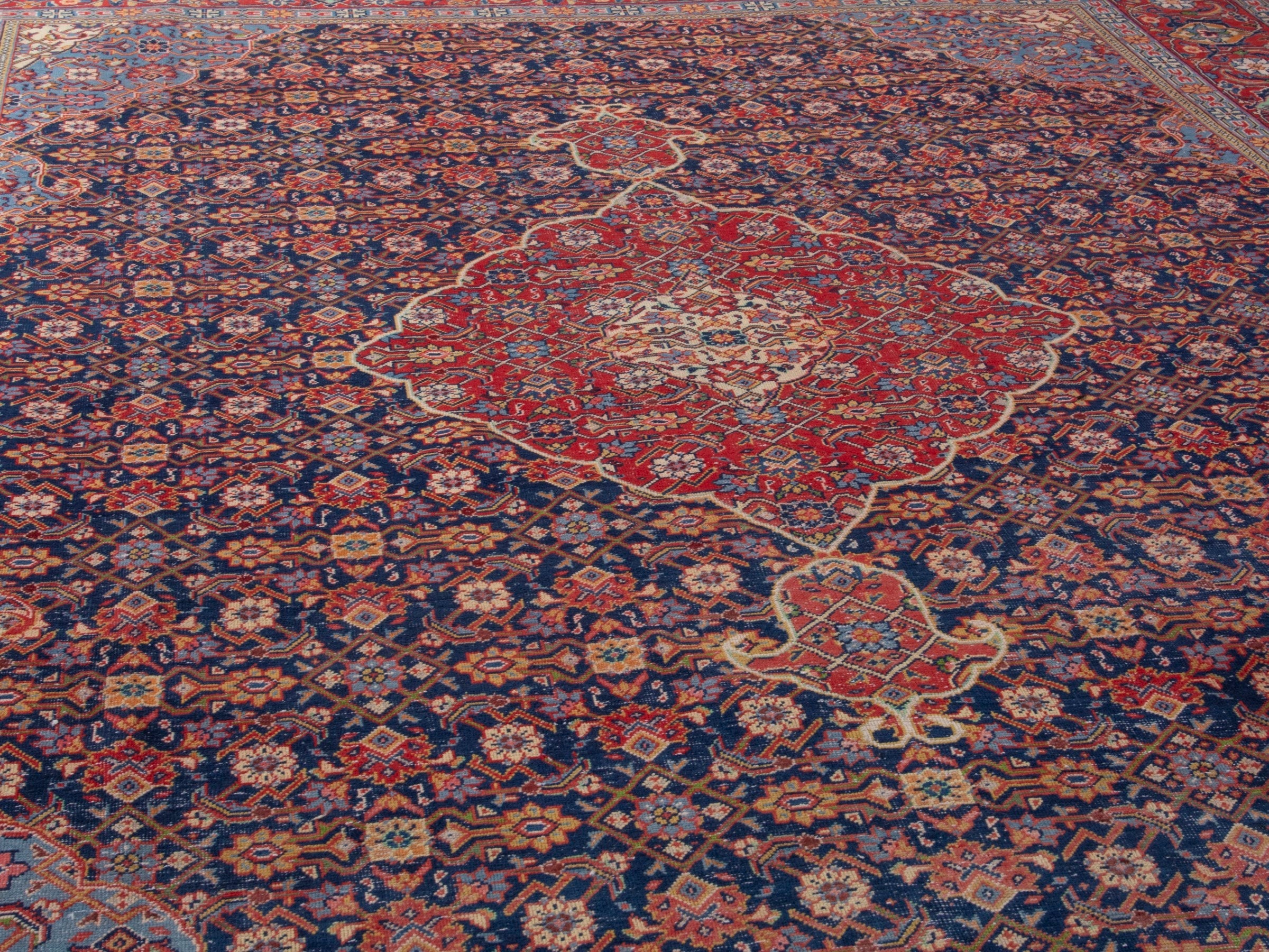 Persian Mahal oversized rug in navy and deep red, view 9 of 21