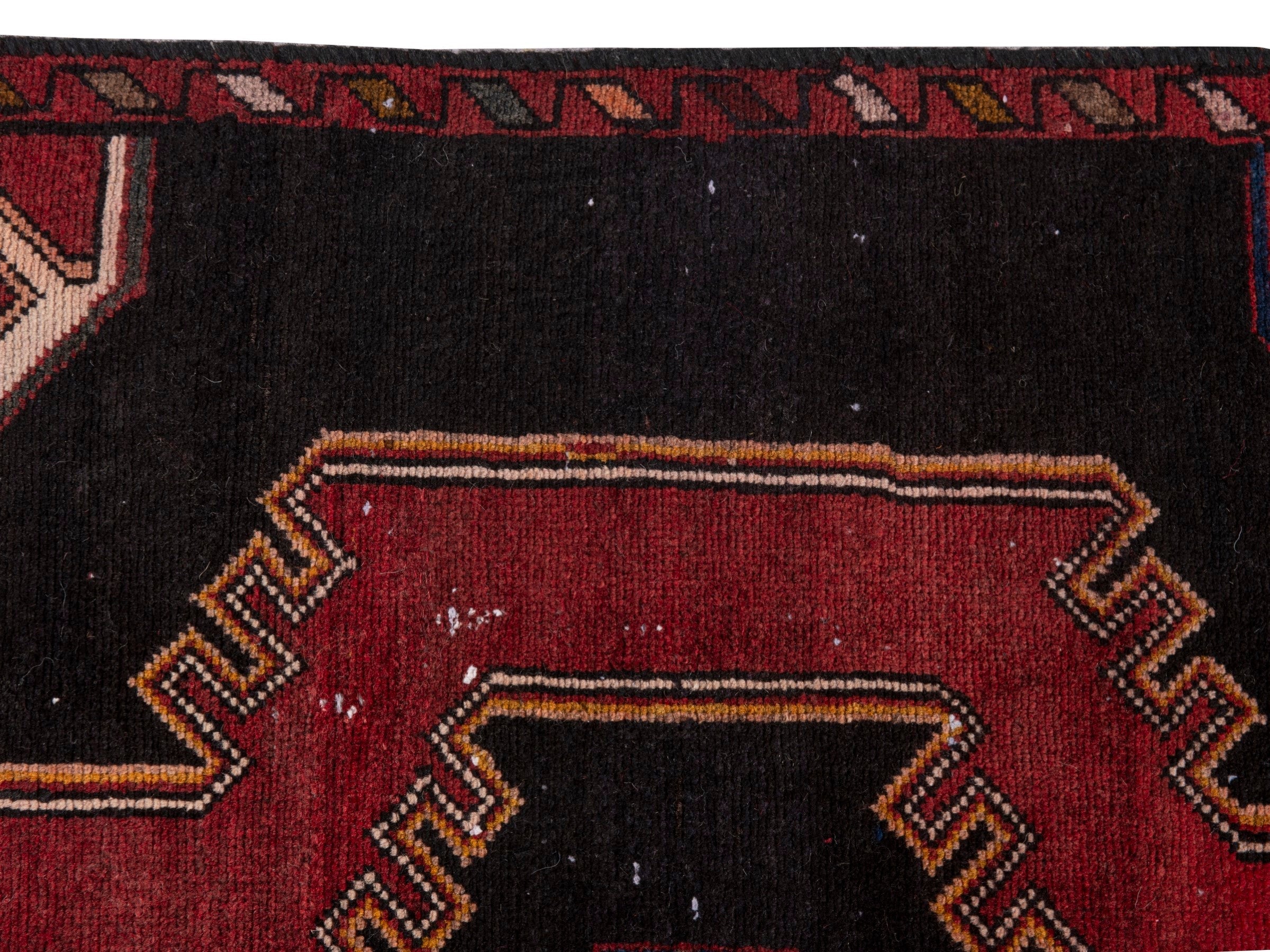 Persian Saveh runner rug in black and burgundy, view 15 of 20