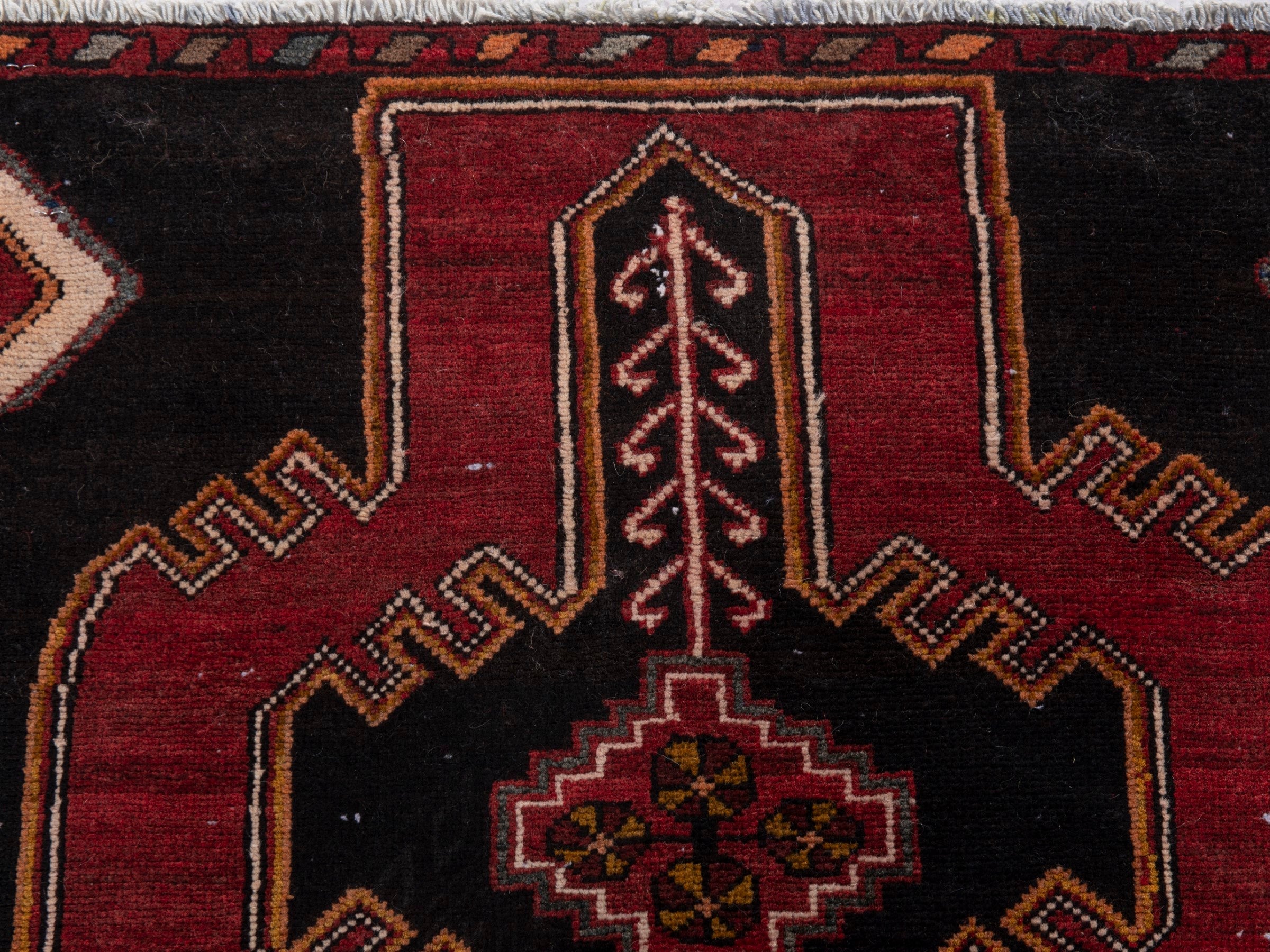 Persian Saveh runner rug in black and burgundy, view 16 of 20