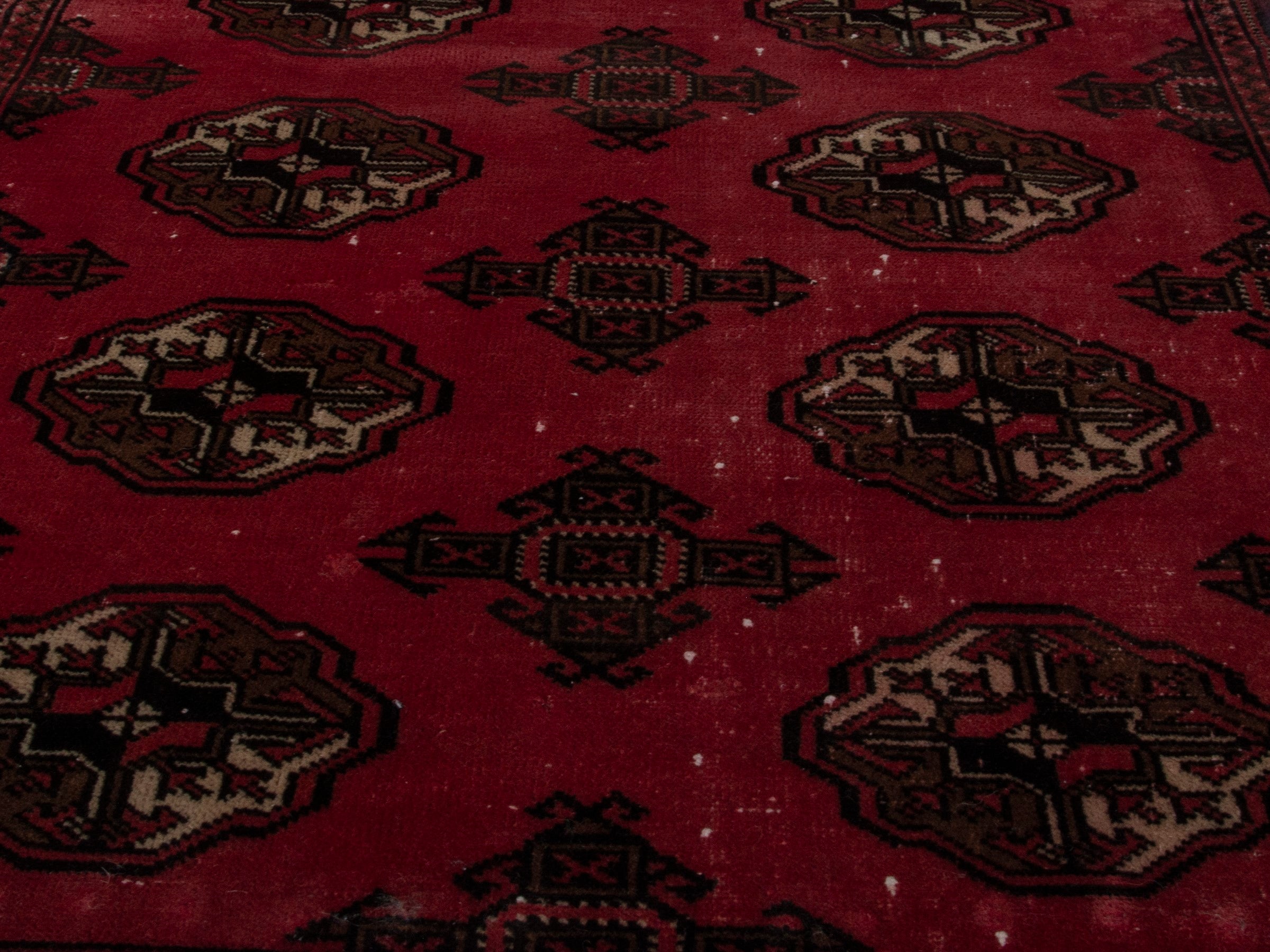 Persian Torkaman accent rug in deep red and dark brown, view 9 of 17