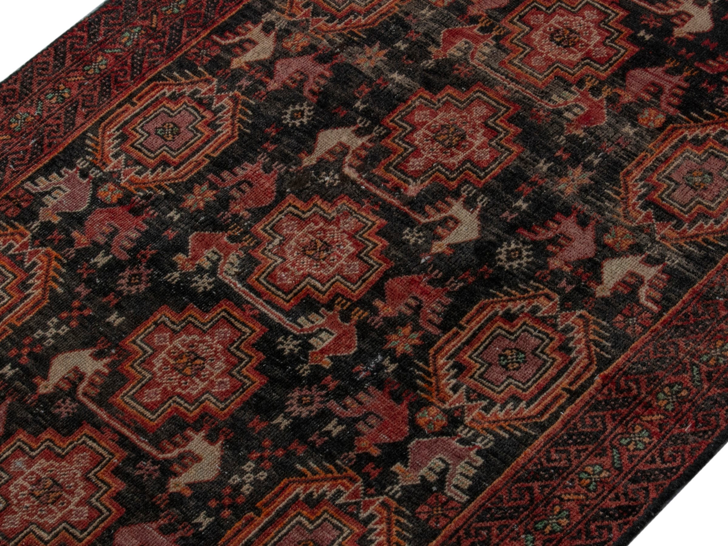 Persian Baluch accent rug in dark blue and burgundy, view 3 of 16