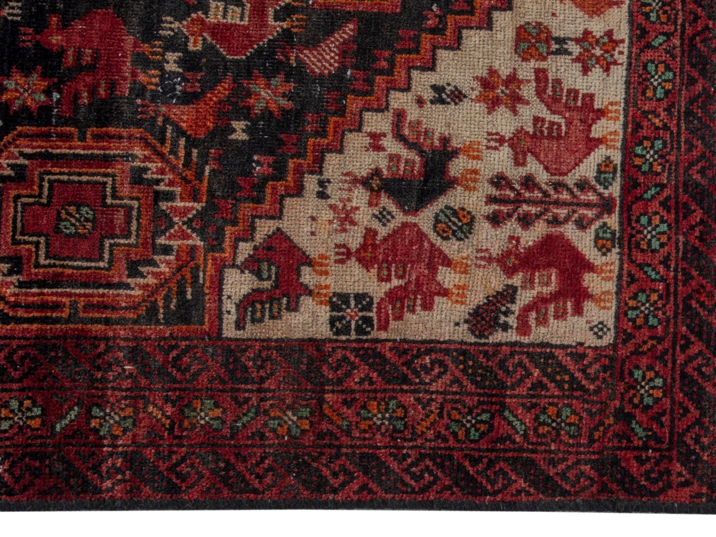 Persian Baluch accent rug in dark blue and burgundy, view 4 of 16