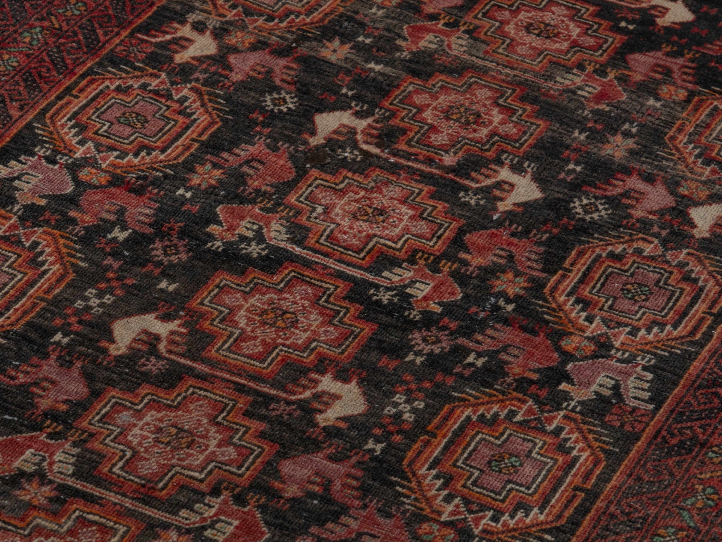 Persian Baluch accent rug in dark blue and burgundy, view 8 of 16