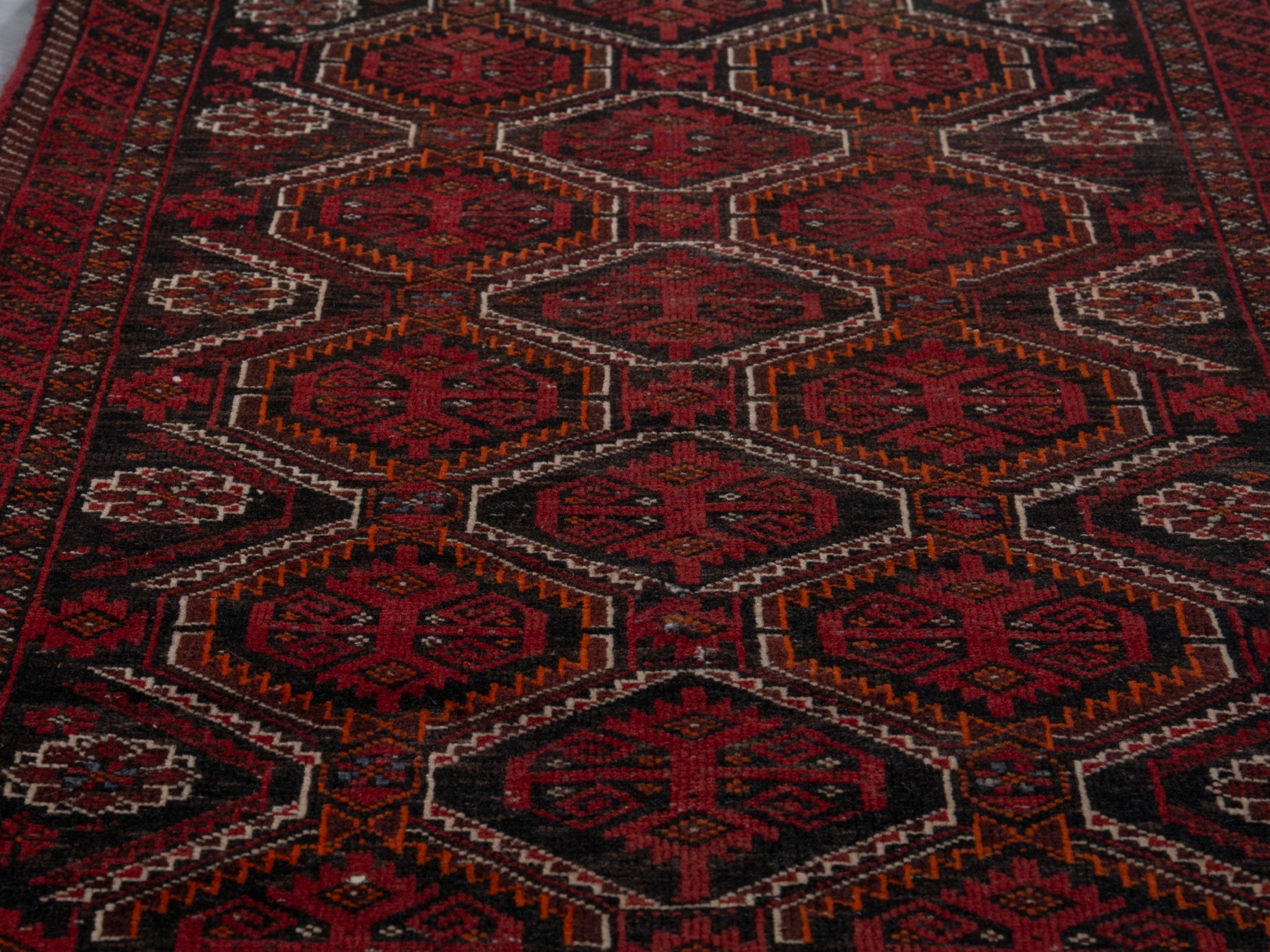 Persian Baluch accent rug in burgundy and deep red, view 7 of 16