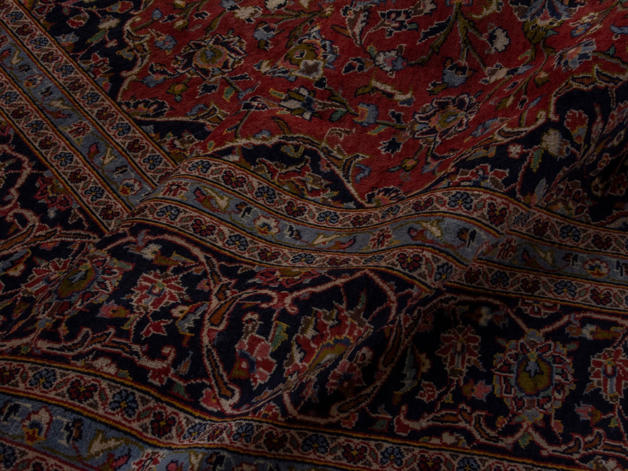 Persian Kashan oversized rug in rust and deep indigo, view 16 of 20