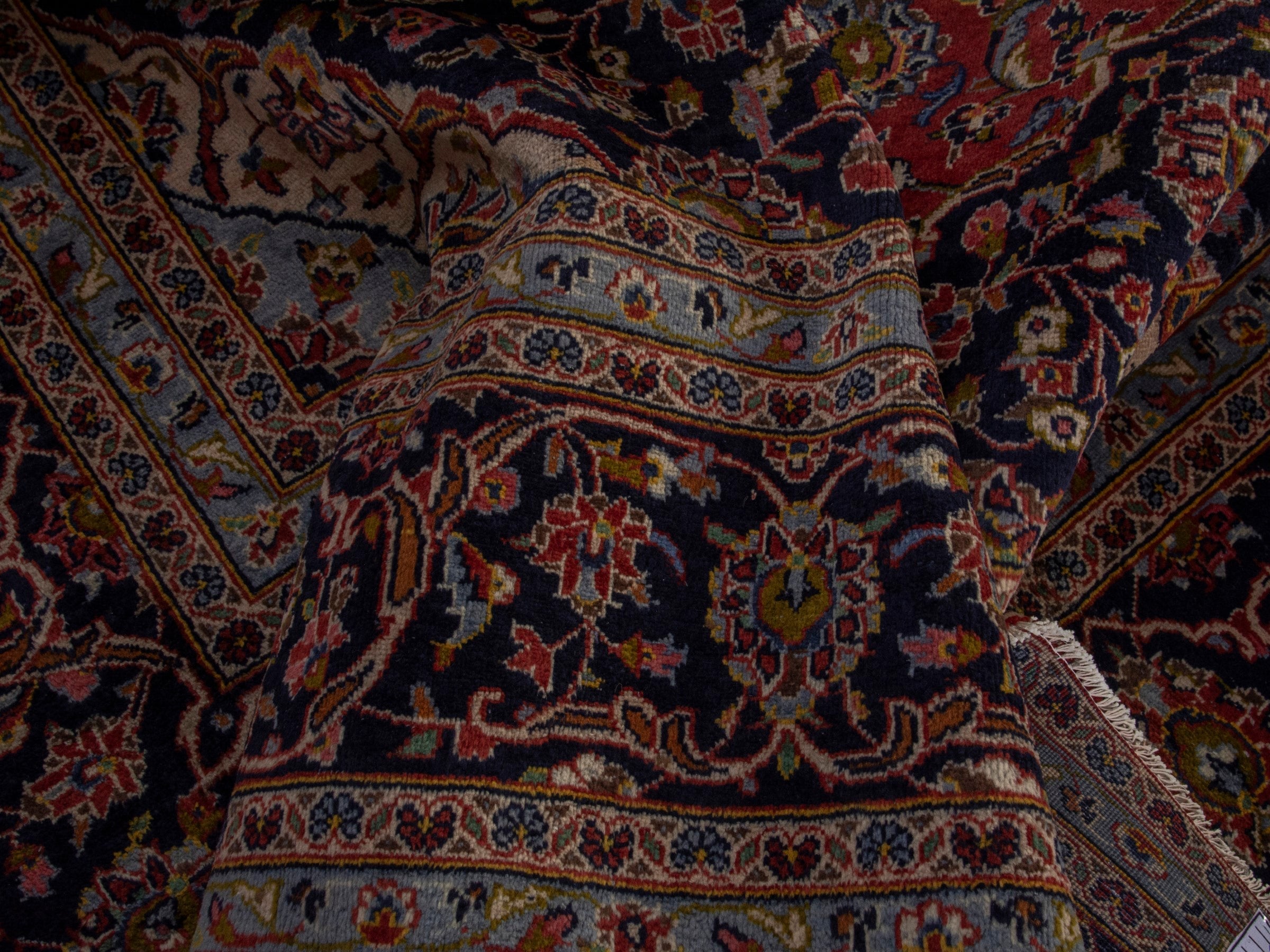 Persian Kashan oversized rug in rust and deep indigo, view 17 of 20