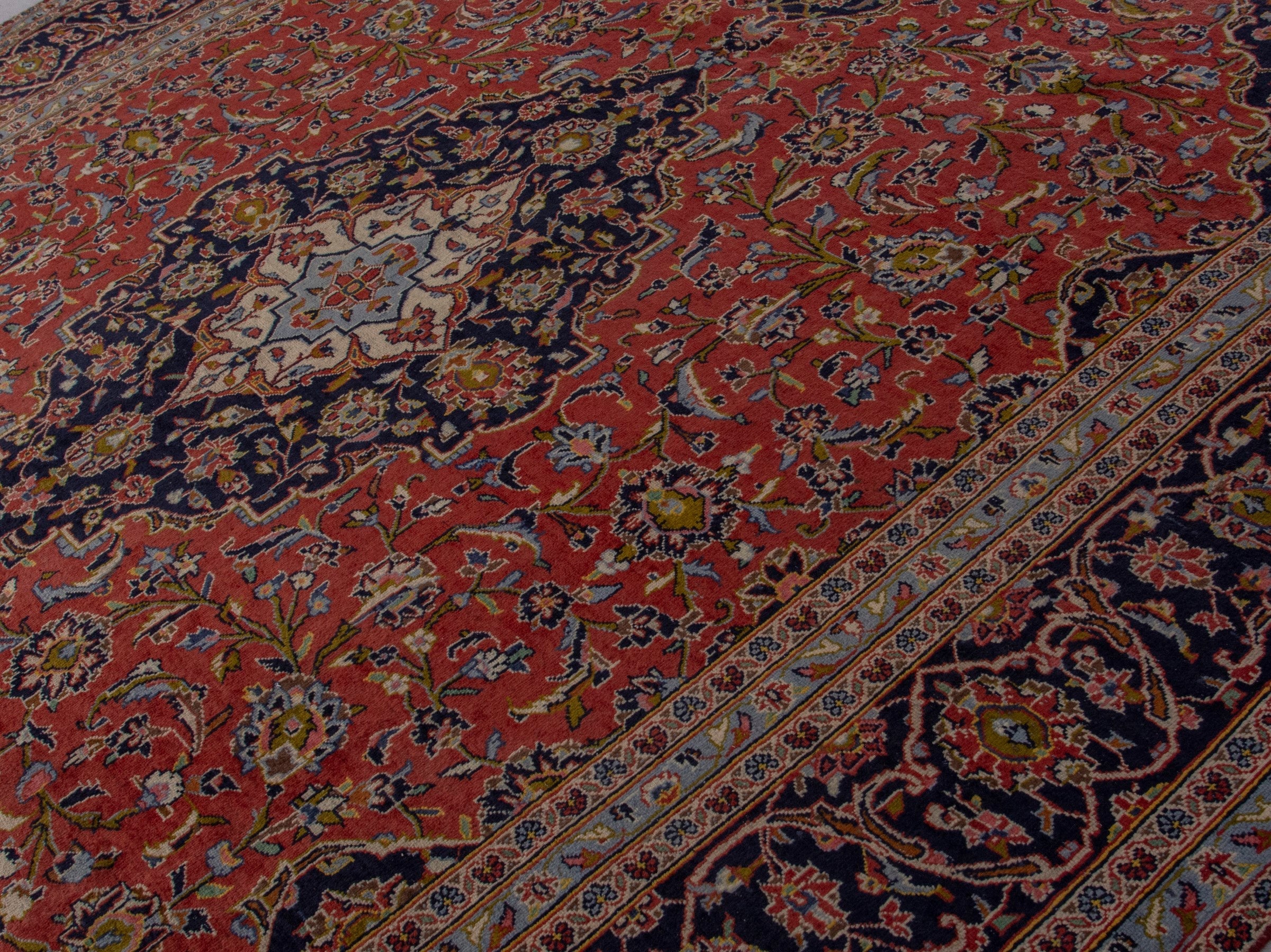 Persian Kashan oversized rug in rust and deep indigo, view 4 of 20