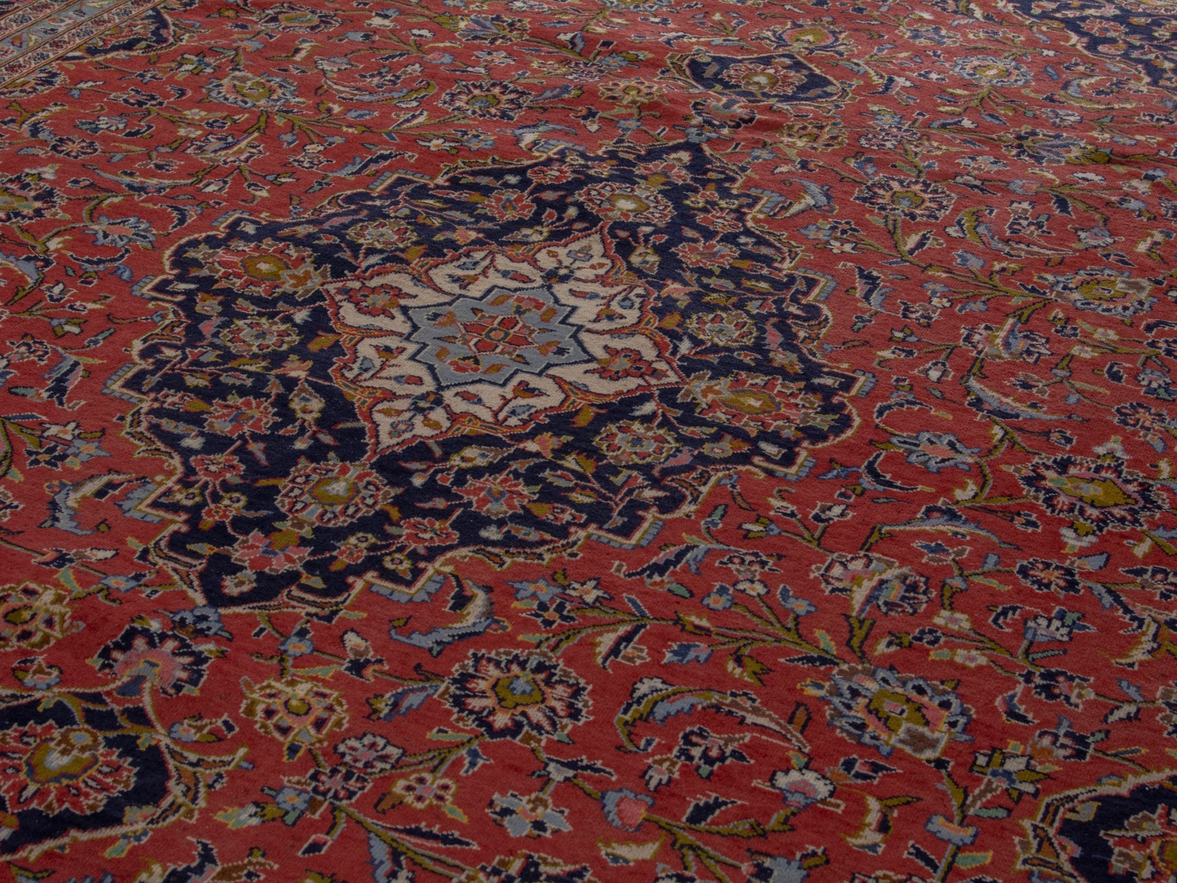Persian Kashan oversized rug in rust and deep indigo, view 9 of 20