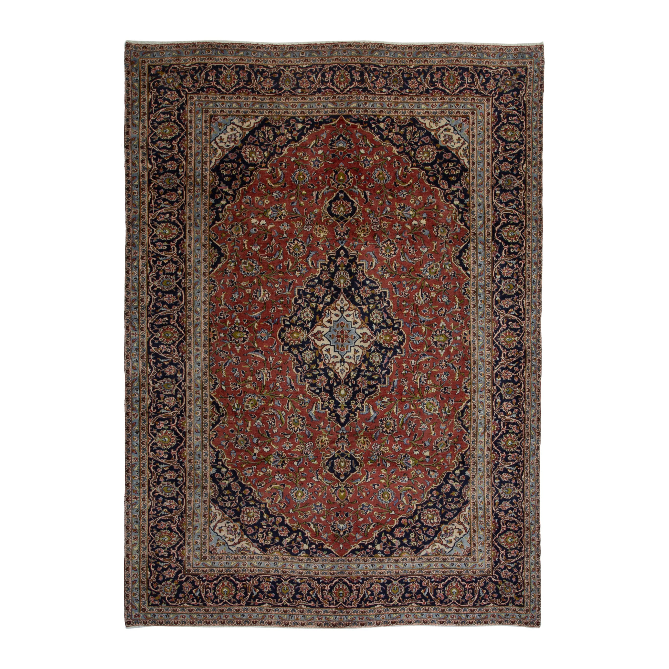 Persian Kashan oversized rug in rust and deep indigo, 9'6" x 13'