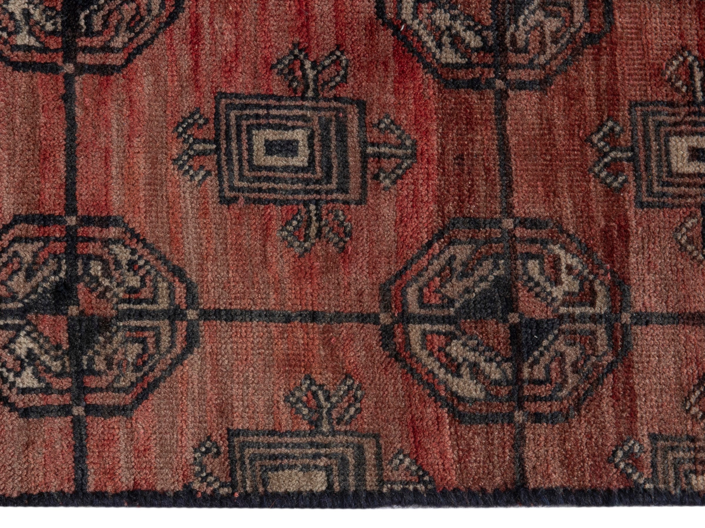 Persian Torkaman accent rug in terracotta and dark brown, view 4 of 8