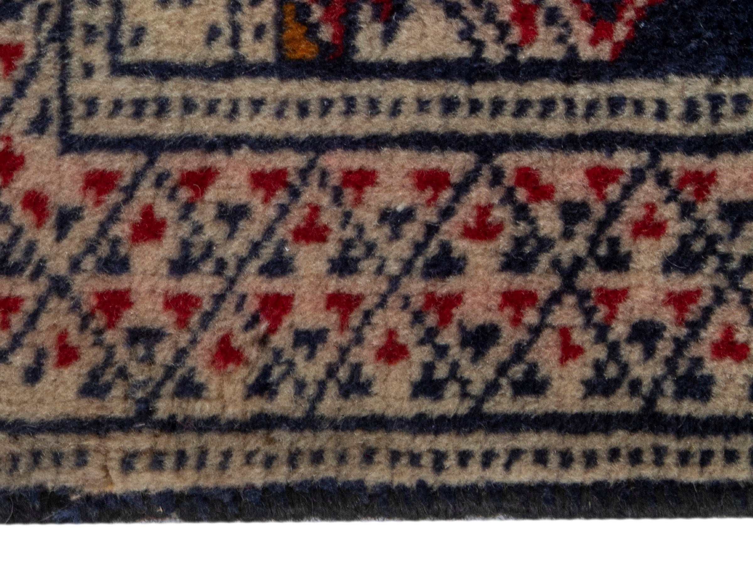 Persian Torkaman accent rug in navy and cream, view 4 of 8