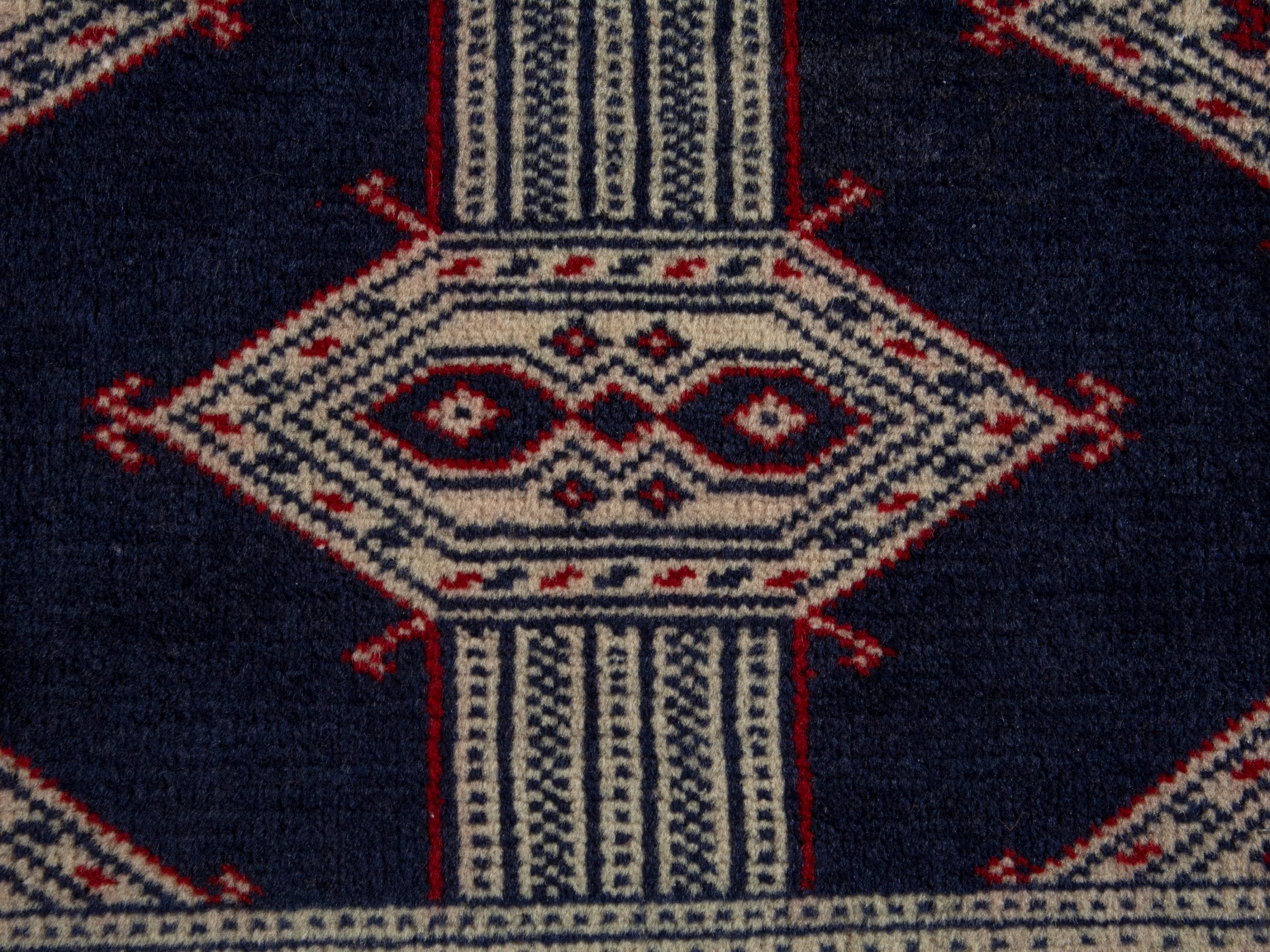 Persian Torkaman accent rug in navy and cream, view 6 of 8