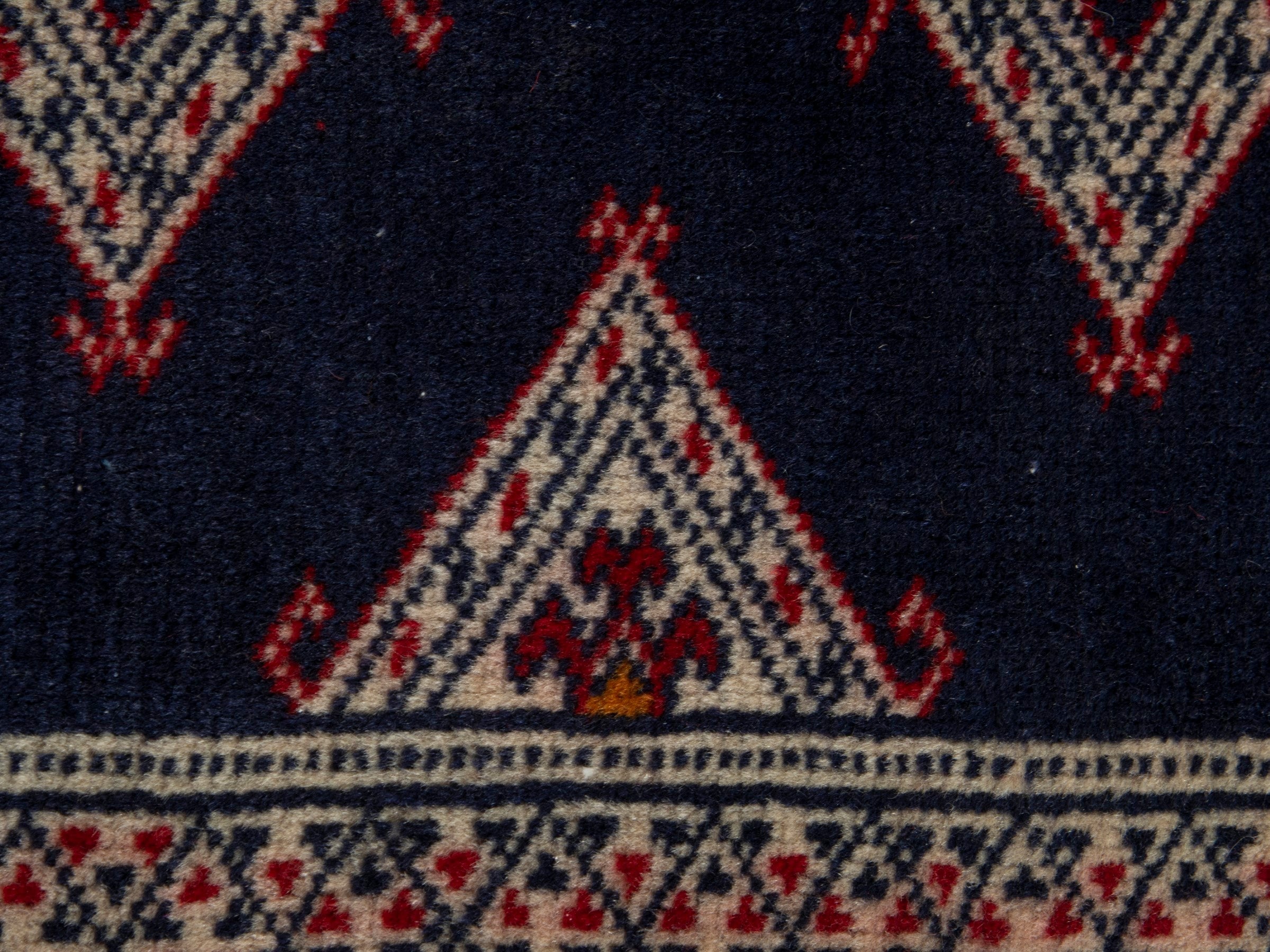 Persian Torkaman accent rug in navy and cream, view 7 of 8