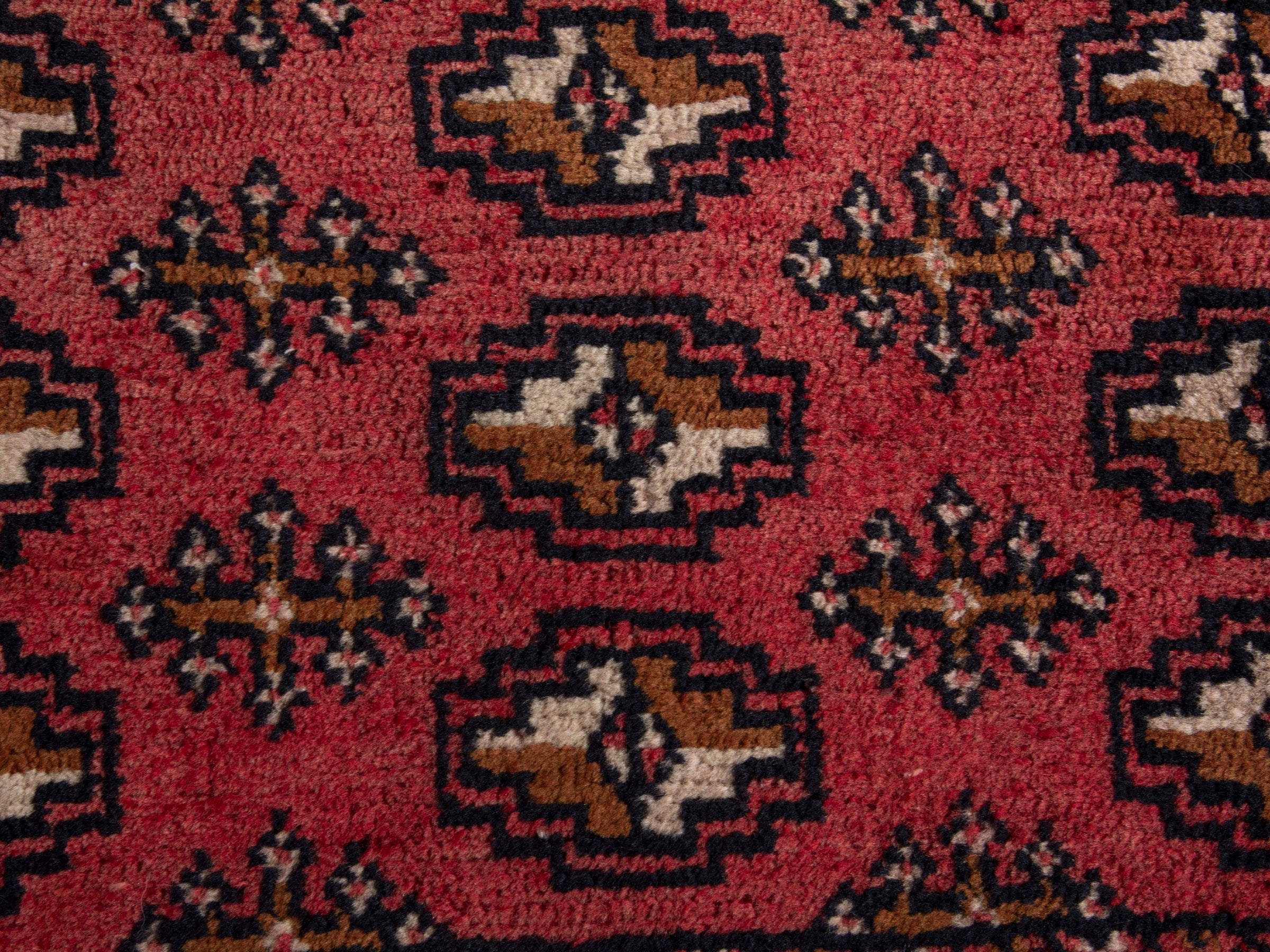 Persian Torkaman accent rug in faded red and black cherry, view 5 of 6