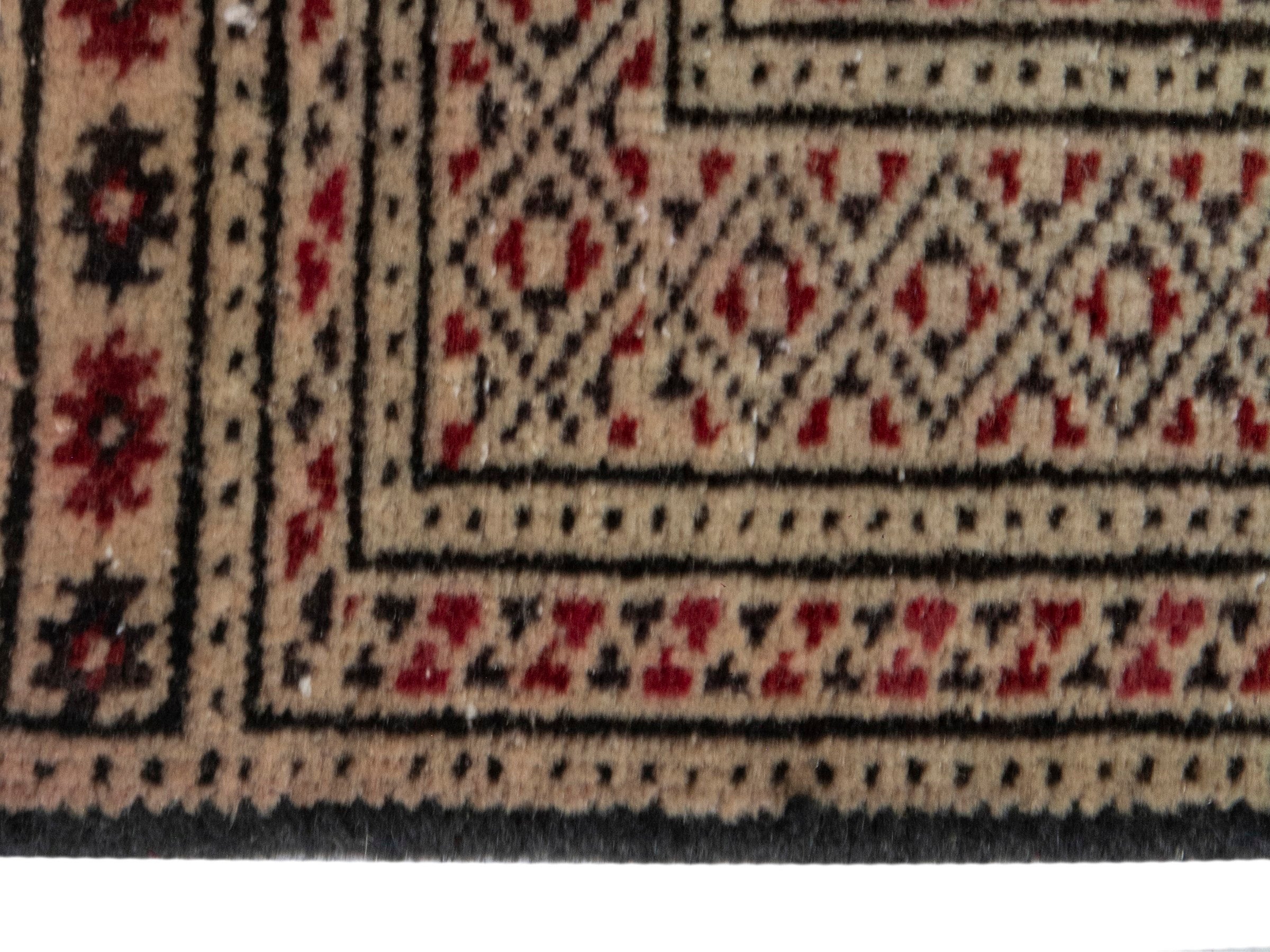 Persian Torkaman accent rug in cream and burgundy, view 4 of 7