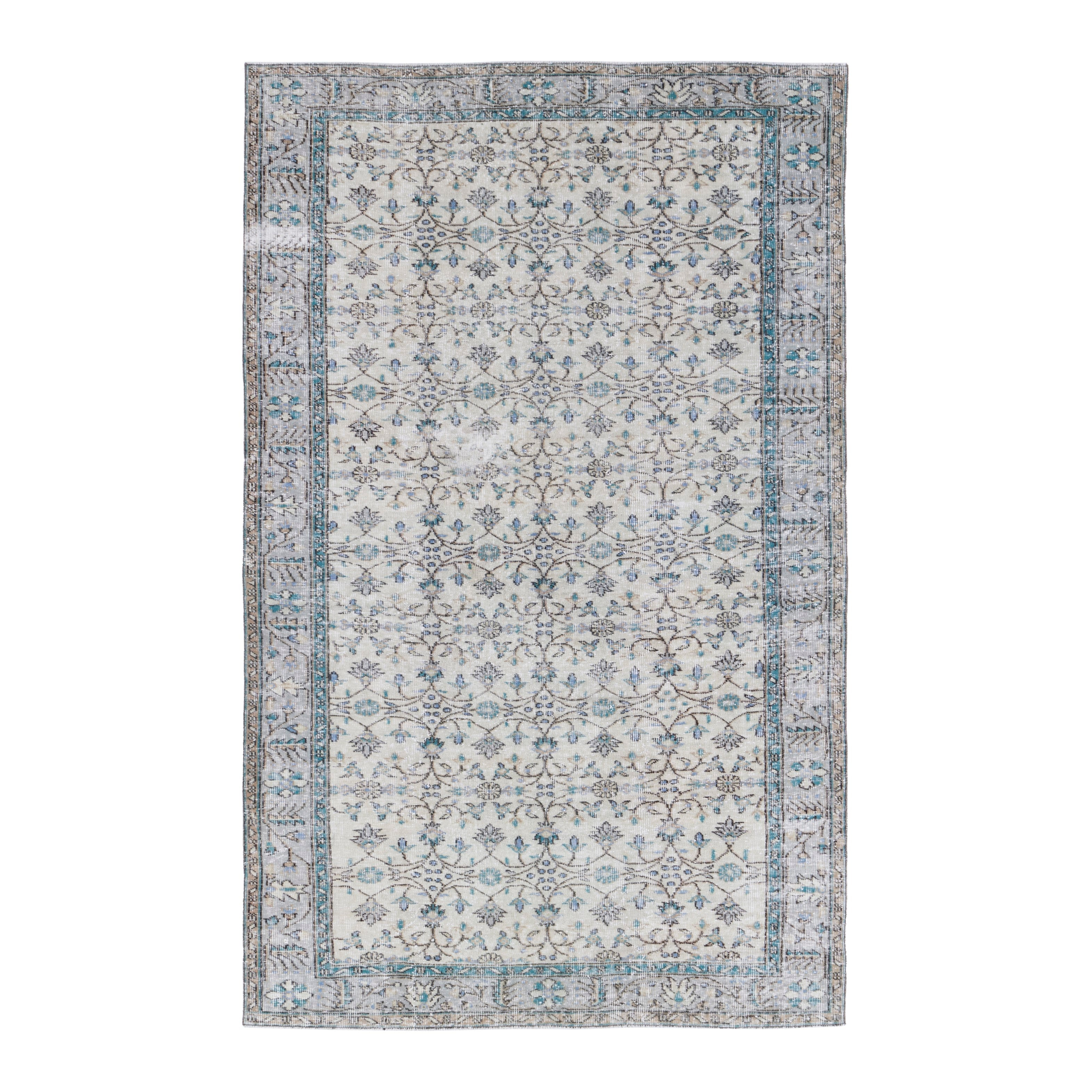 Turkish Manisa area rug in ivory and denim, 5'7" x 9'