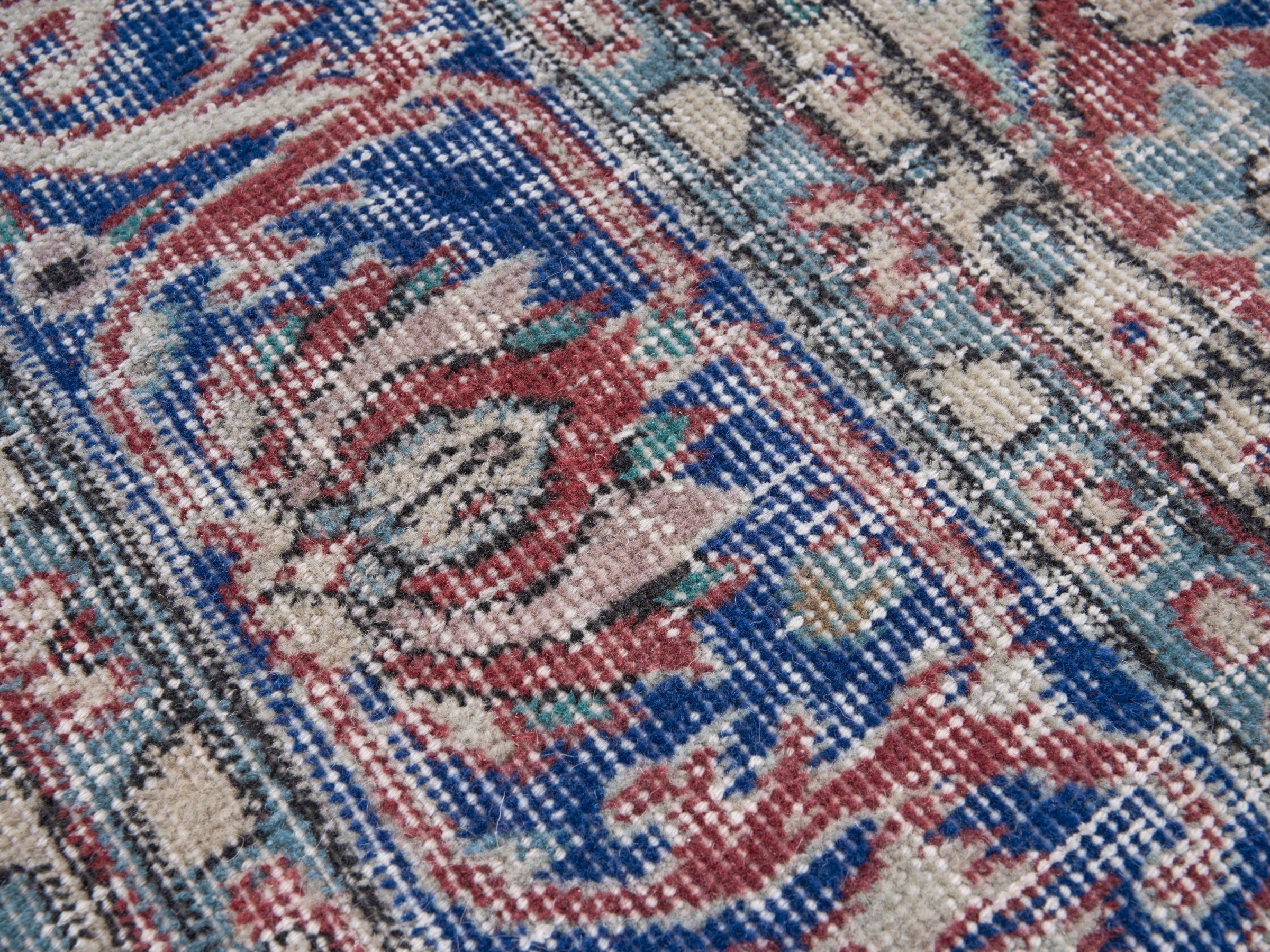 Turkish Isparta area rug in faded red and navy, view 6 of 10