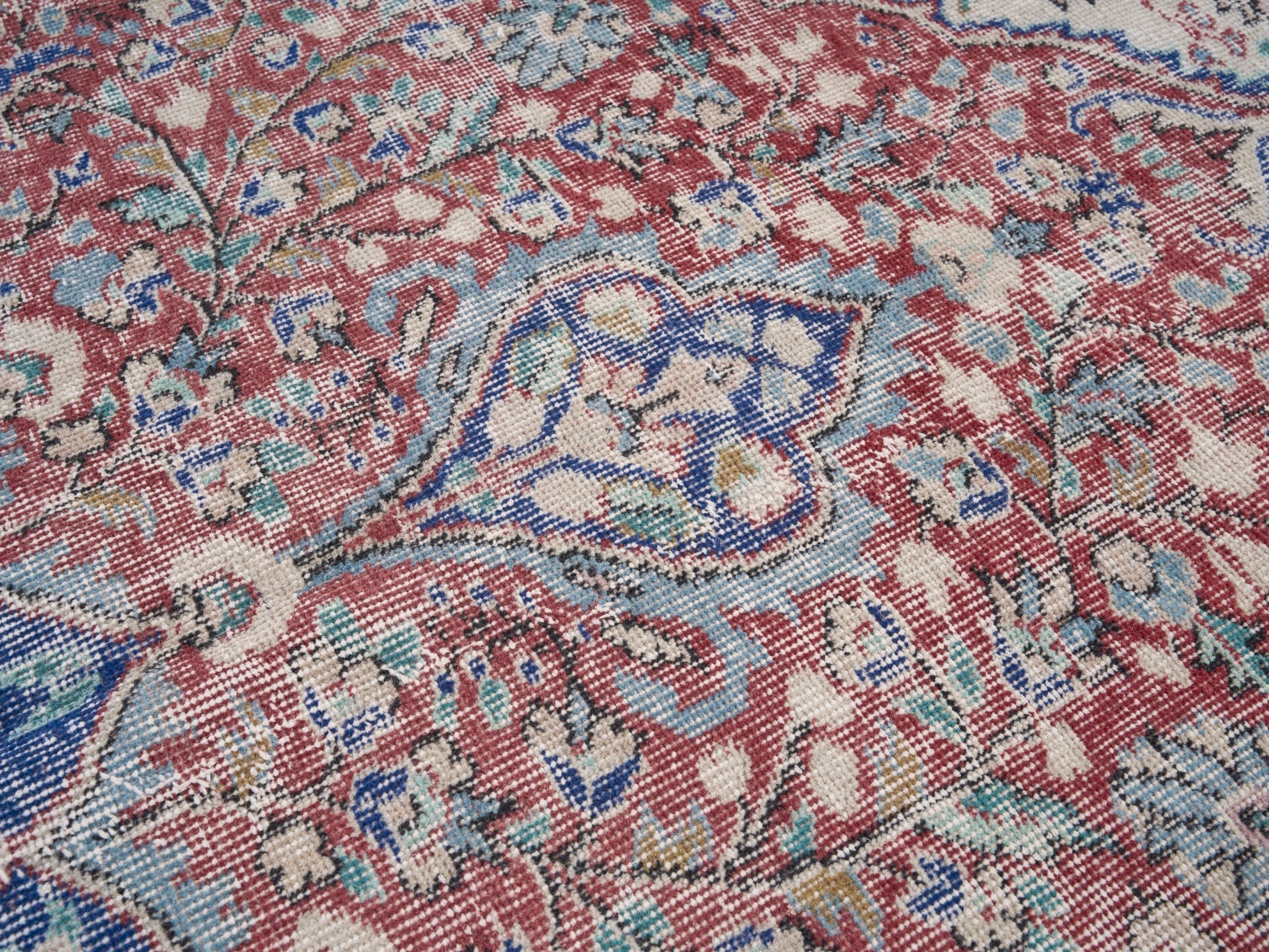 Turkish Isparta area rug in faded red and navy, view 7 of 10