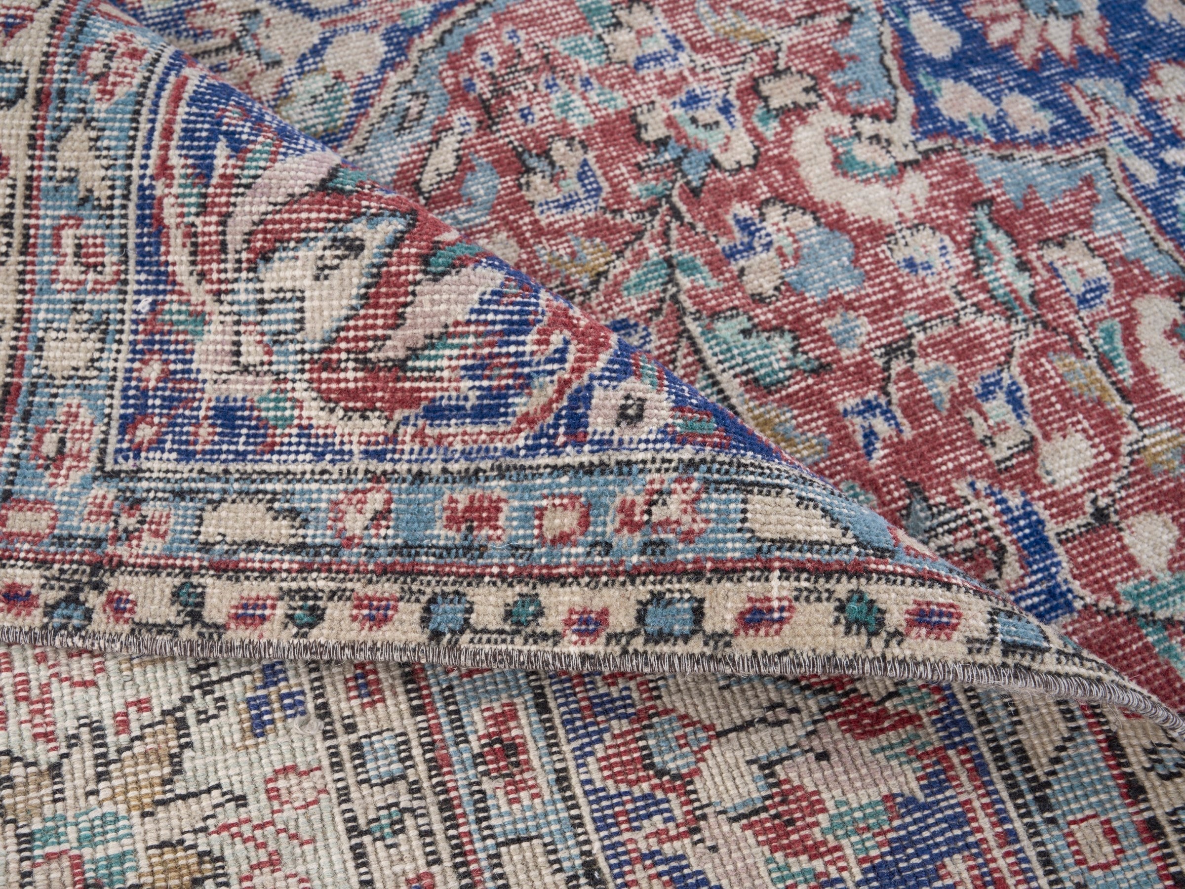 Turkish Isparta area rug in faded red and navy, view 8 of 10