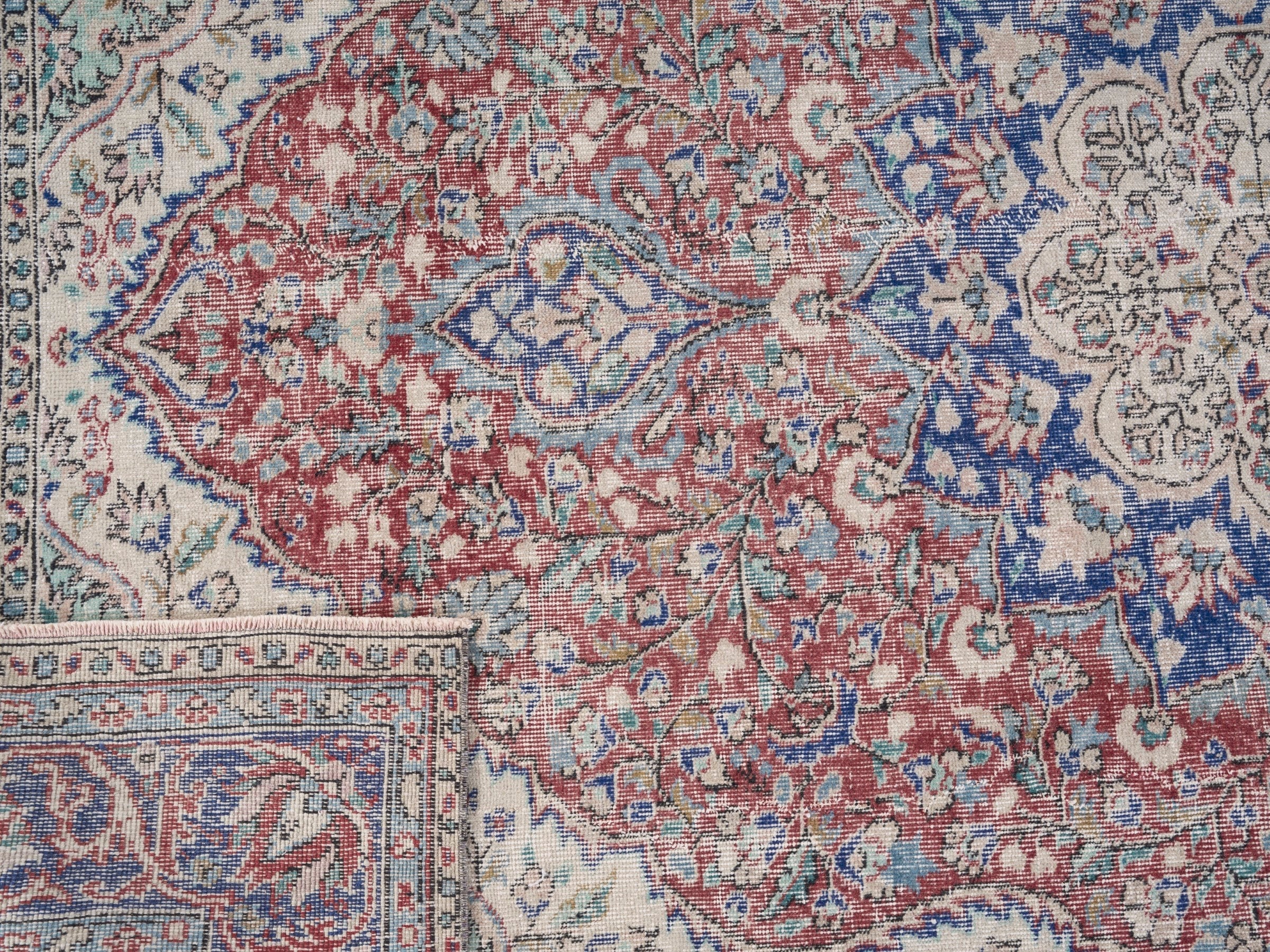 Turkish Isparta area rug in faded red and navy, view 10 of 10