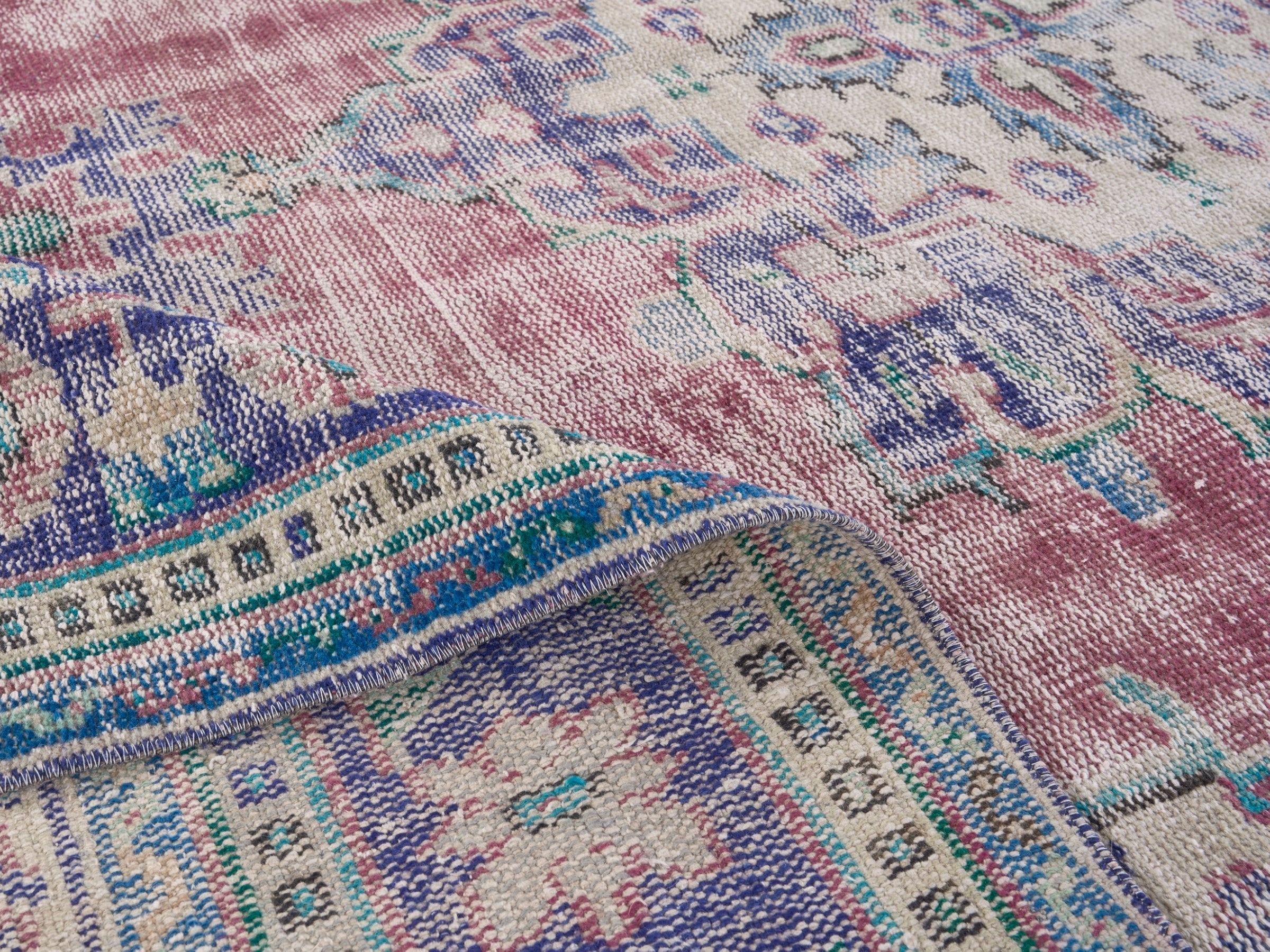 Turkish Manisa oversized rug in dusty rose and navy, view 9 of 10