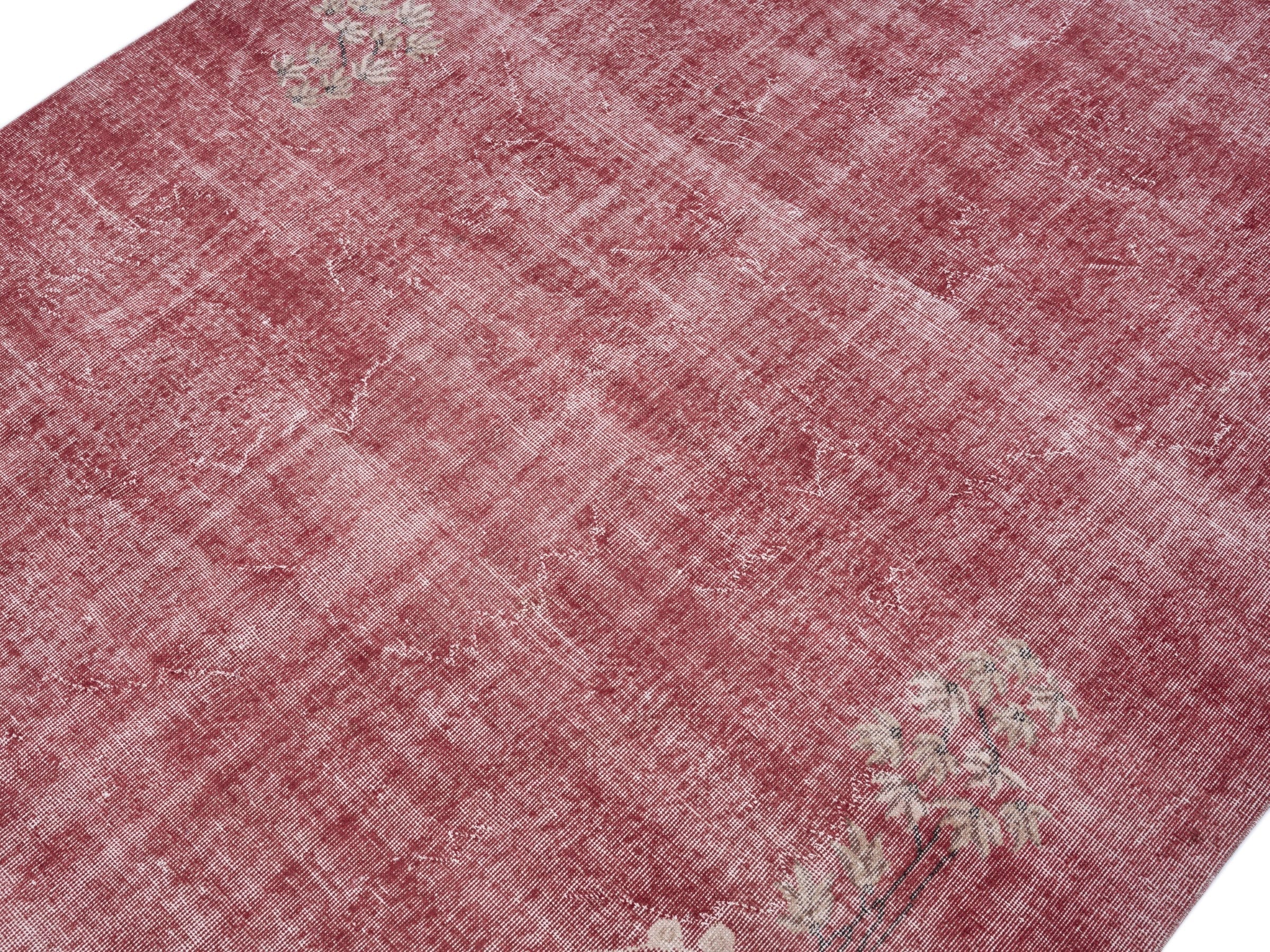 Turkish Isparta area rug in faded red and muted pink, view 5 of 10